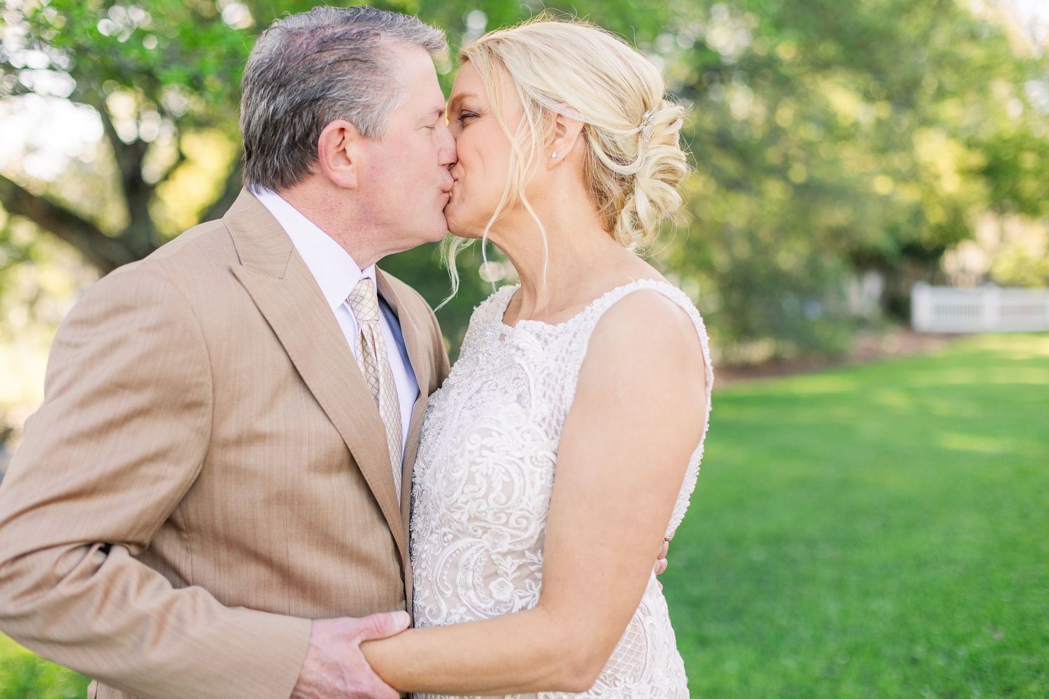 Romantic outdoor wedding portraits captured in golden afternoon light.