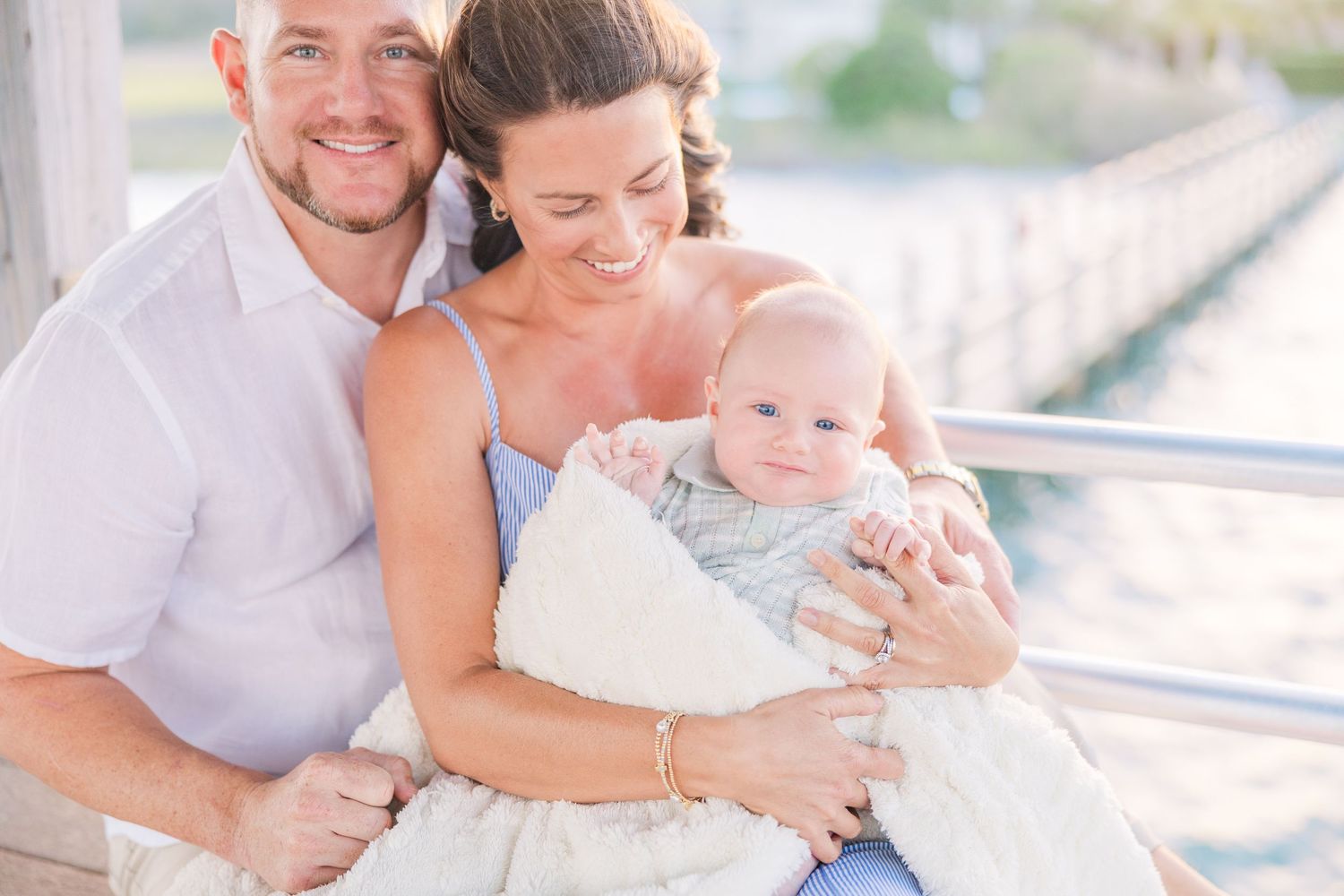Tender family moments captured during sunset beach photoshoot.