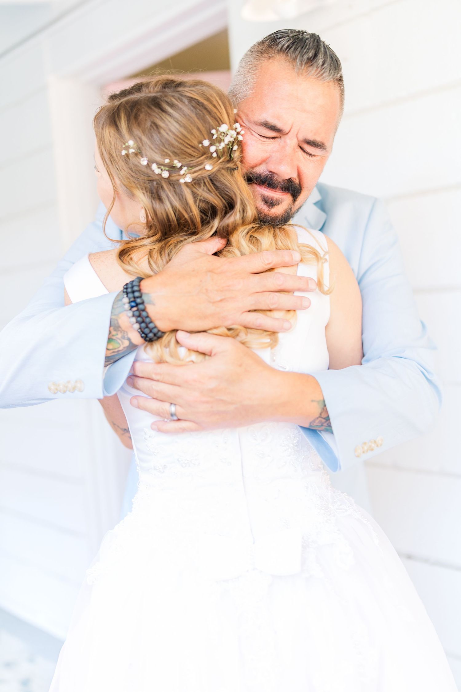 A tender embrace between a couple on their wedding day.