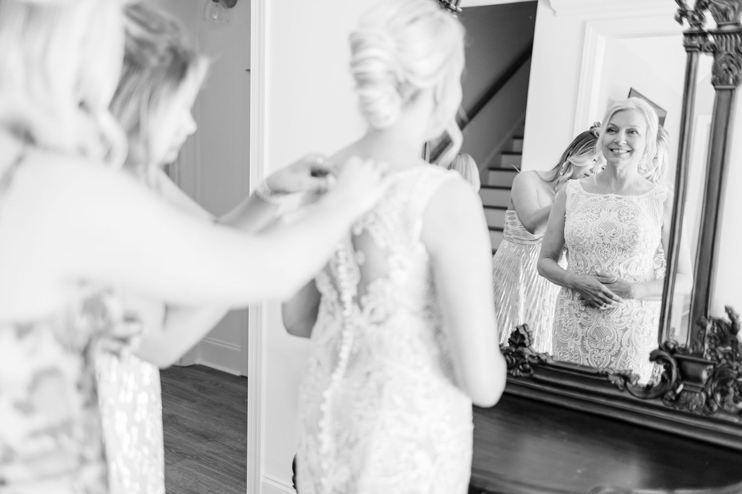 Black and white getting ready photos show wedding dress landfall wedding bride groom light and airy classic wilmington Wrightsville Beach