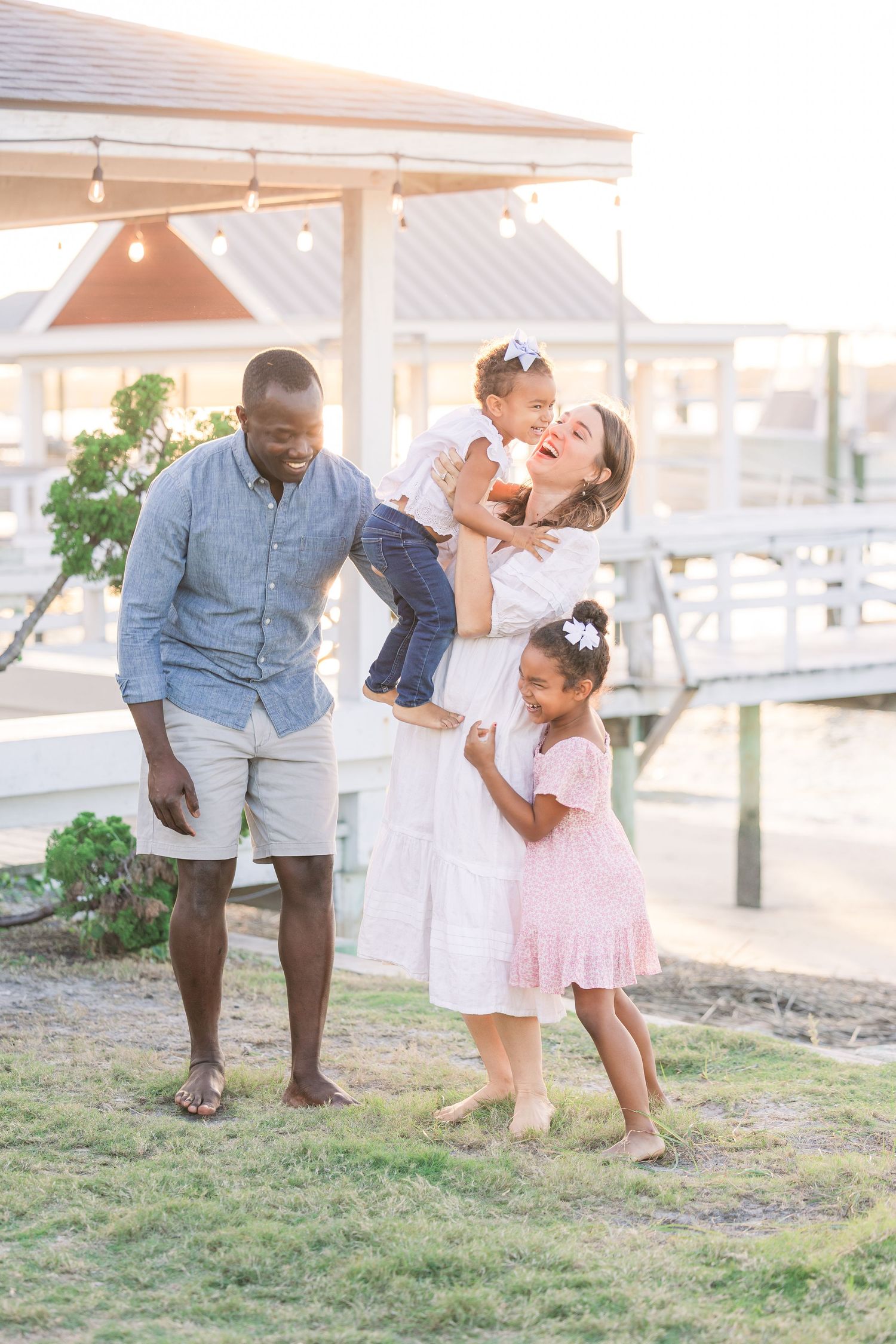 Candid family interactions captured during sunset beach photo session.