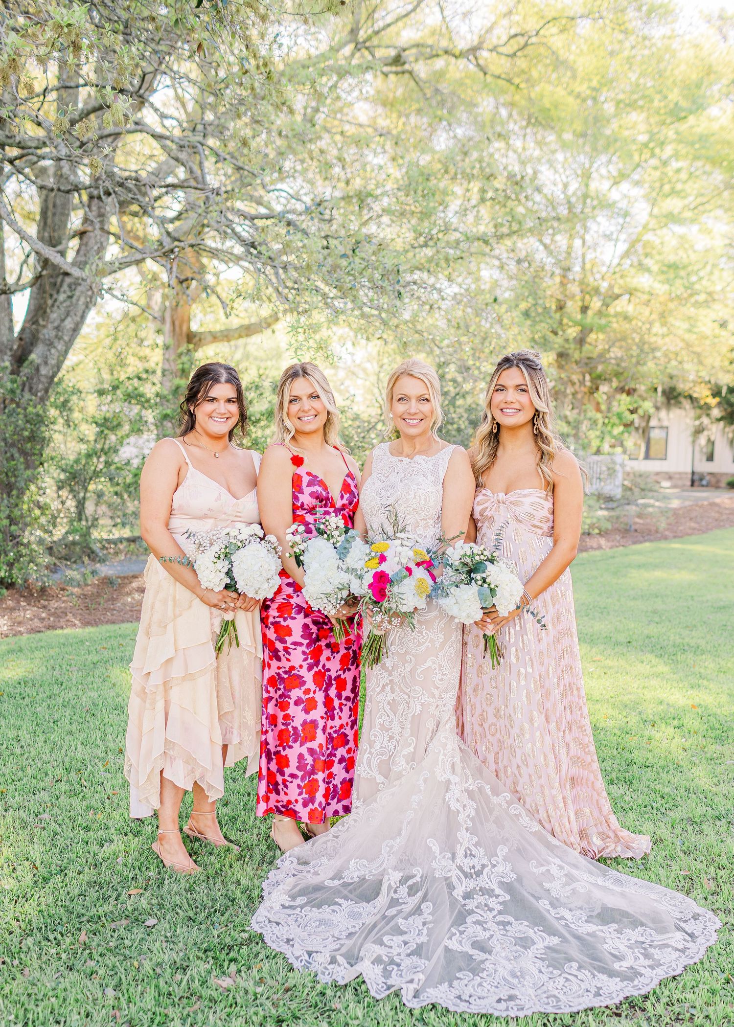 Bridal party in pink and floral dresses landfall wedding bride groom light and airy classic wilmington Wrightsville Beach