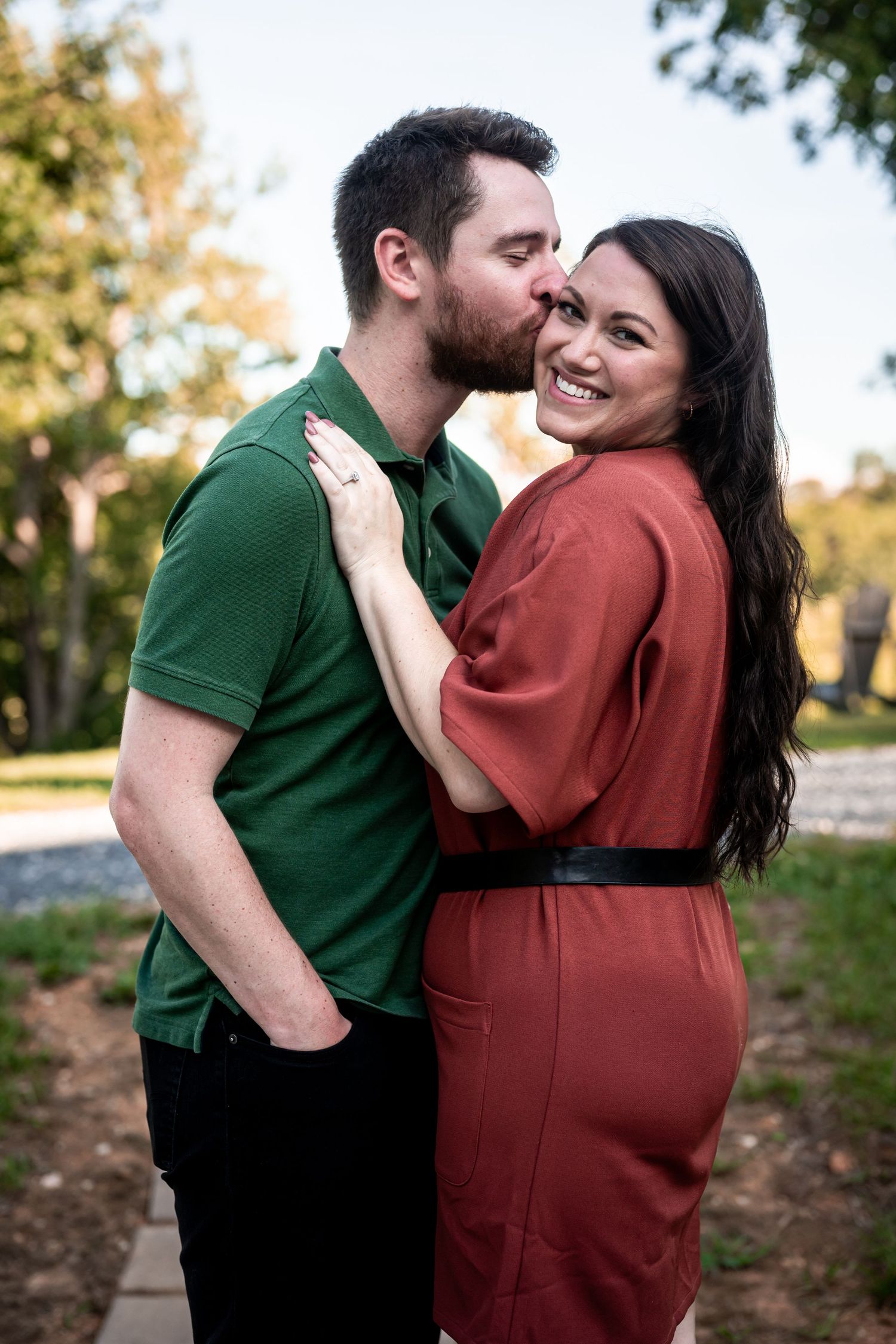Couple laughing together during an outdoor photo session.