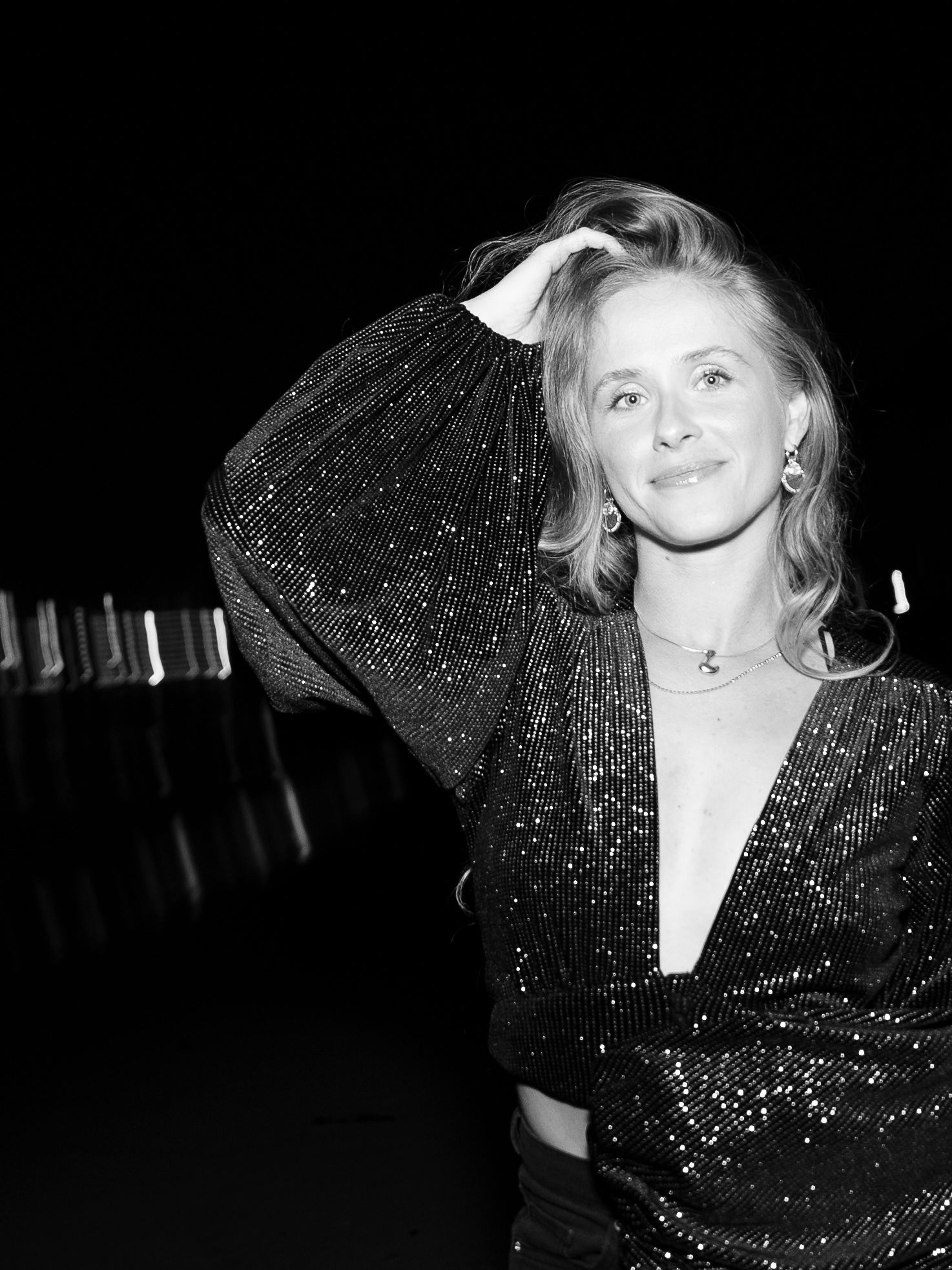 Black and white glamour portrait featuring sparkly evening wear and dramatic poses.