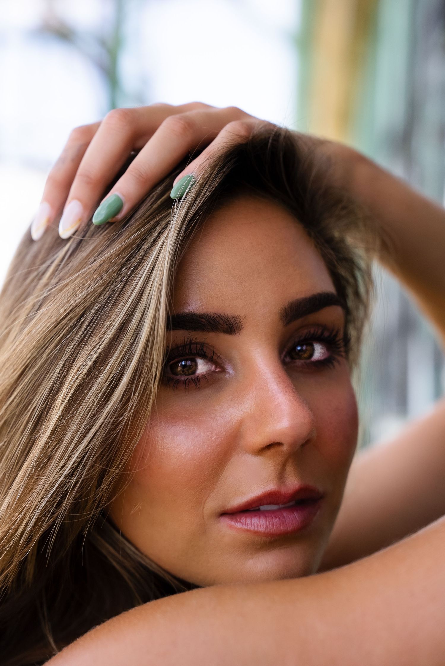 Close up beauty portrait with soft natural lighting and pink lipstick.