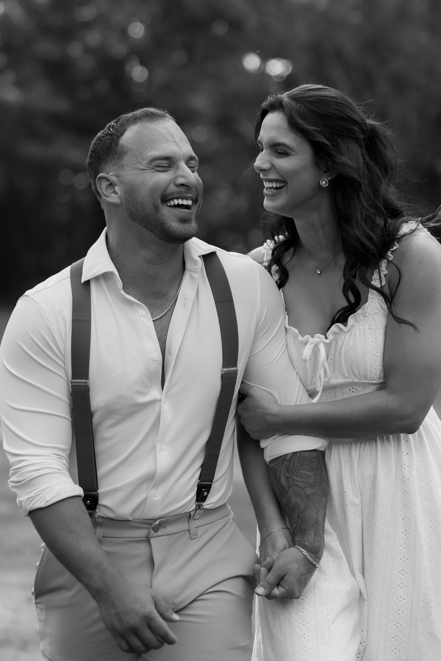 Black and white photos of a couple laughing together in casual wedding attire.