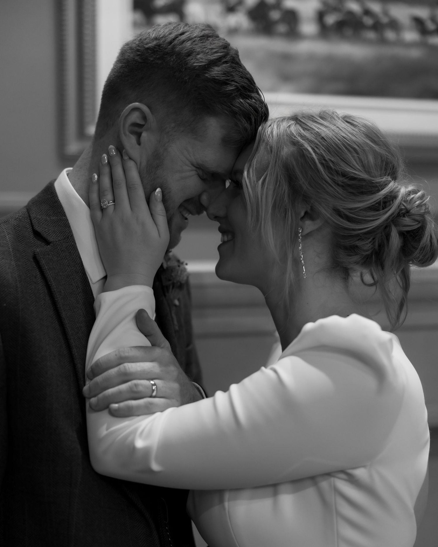 Intimate black and white wedding portraits showing tender moments between the couple.