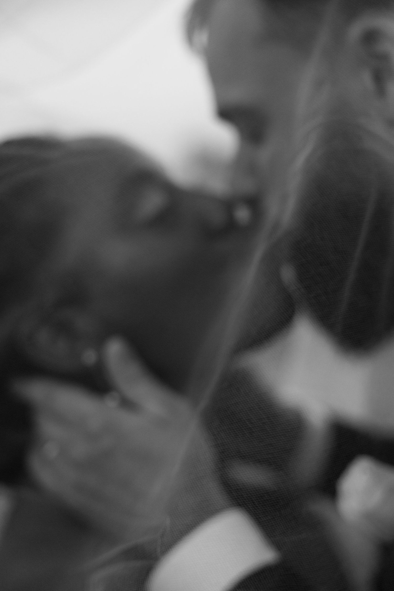 Black and white candid wedding moments captured in an artistic style.