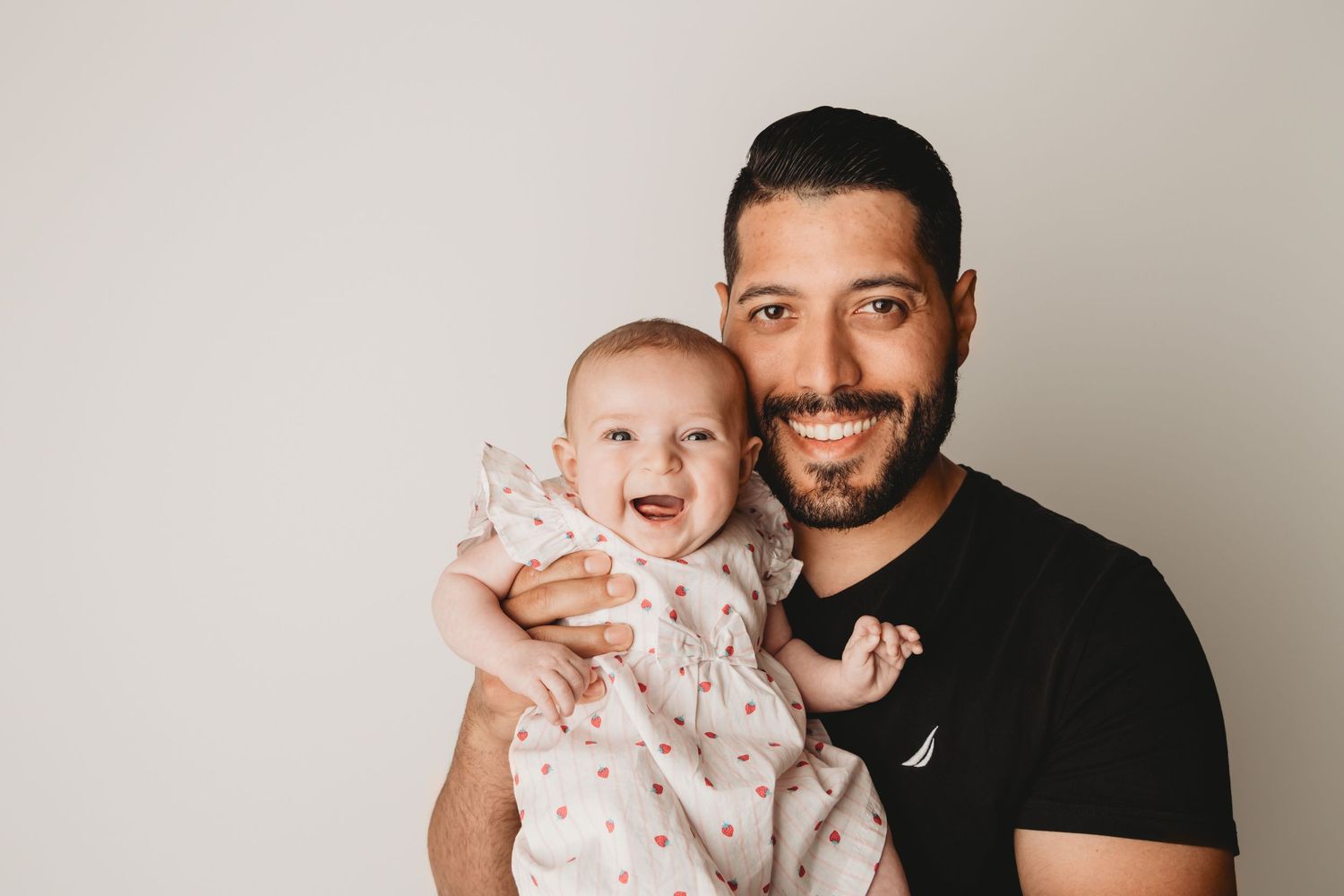 A dad with his baby girl at a Walla Walla portrait studio.