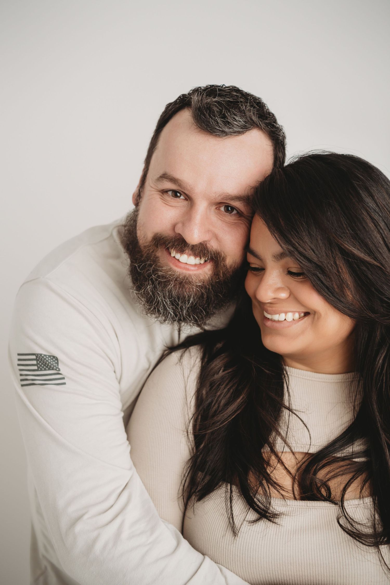 Close-up studio portrait of a couple smiling and embracing during a Walla Walla couples photography session