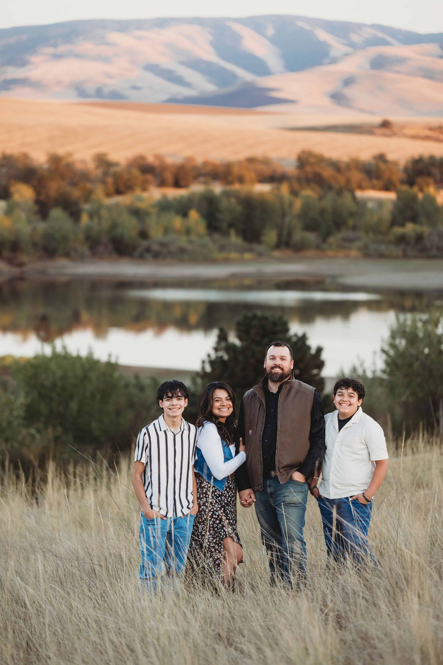 A portrait of a family at Bennington Lake in Walla Walla during the fall season.