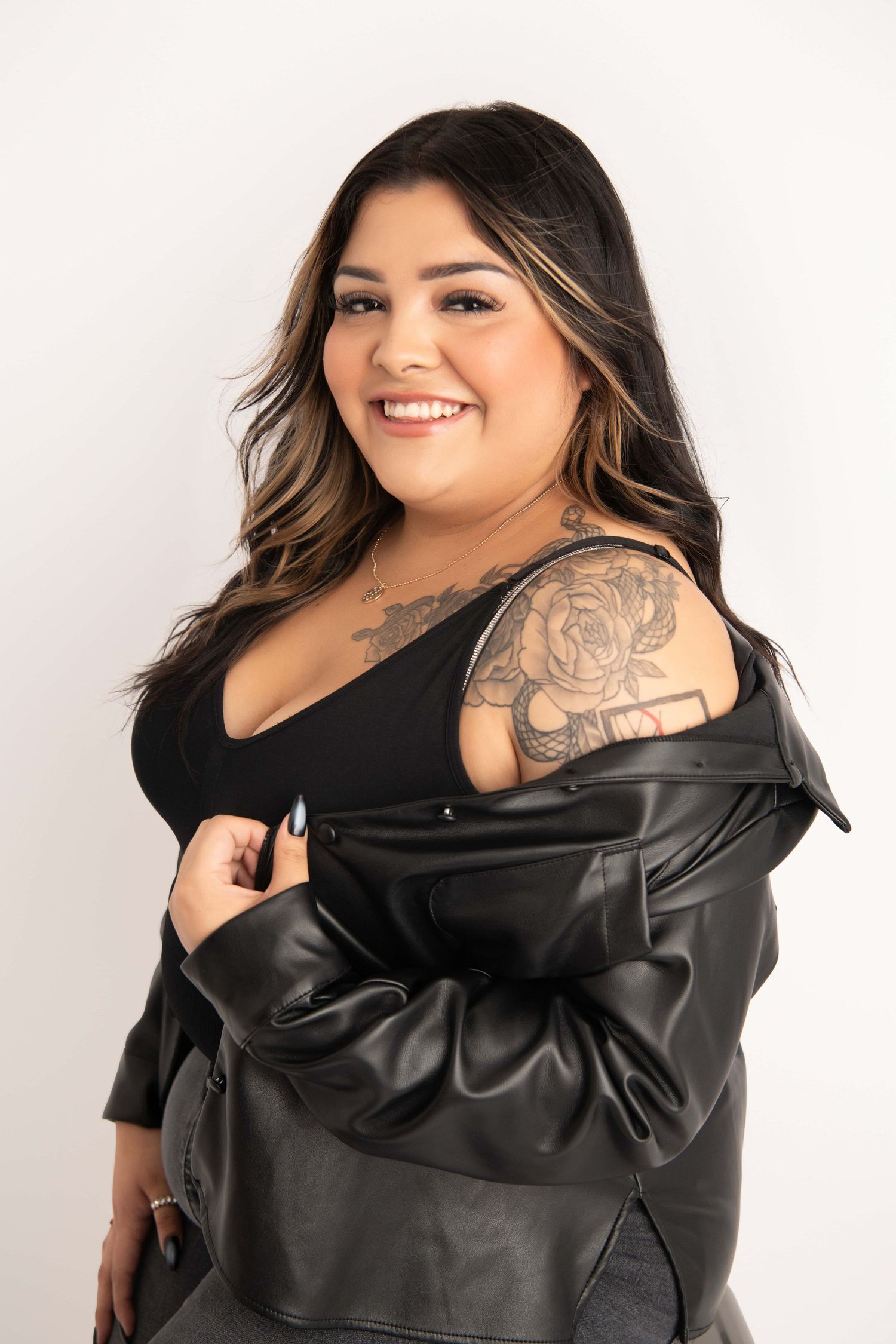 A personal branding image of a woman wearing a leather jacket.