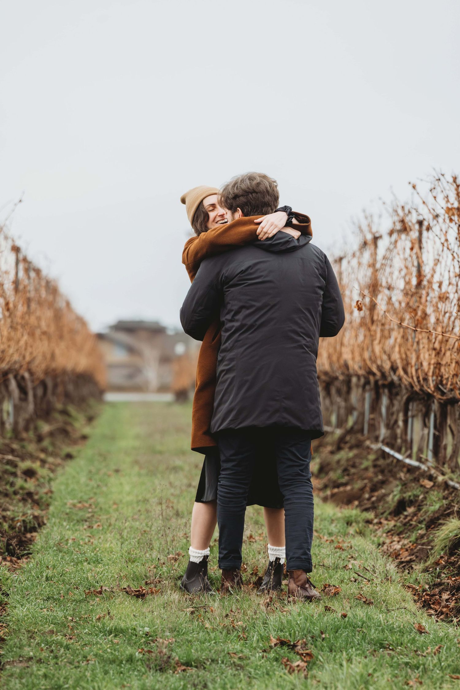 A couple embracing just after getting engaged.