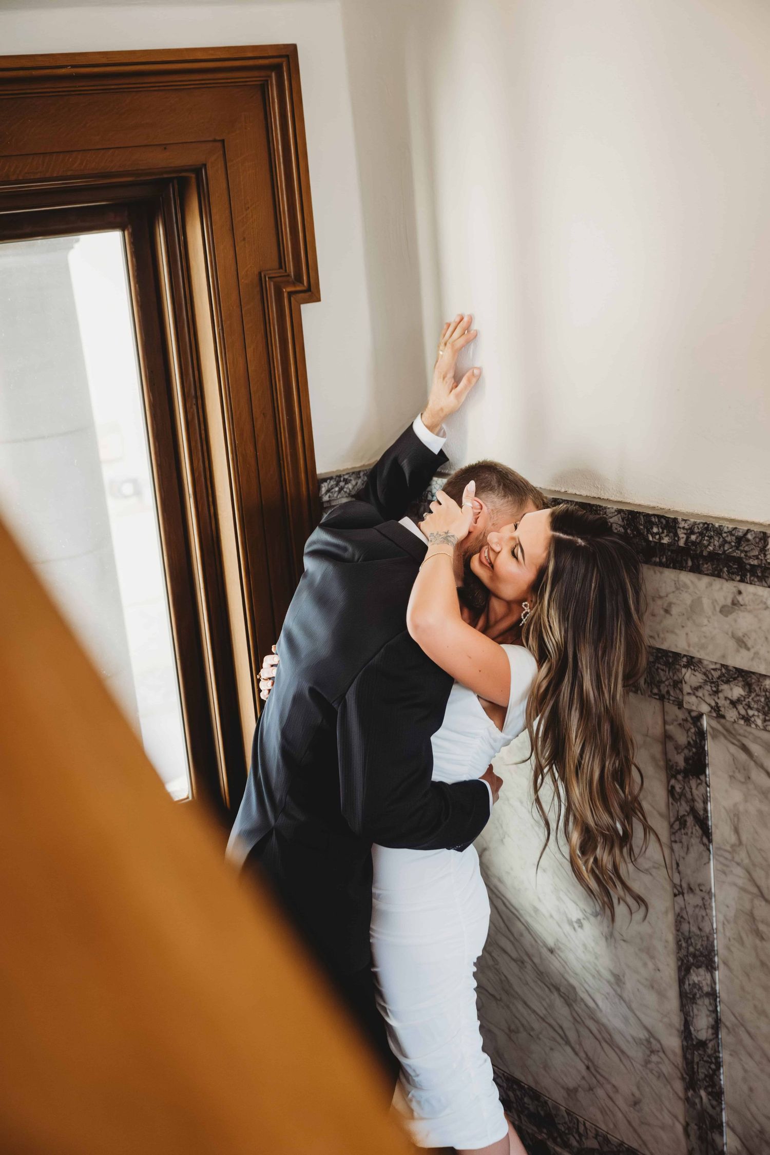 A bride and groom inside the courthouse before their elopement.