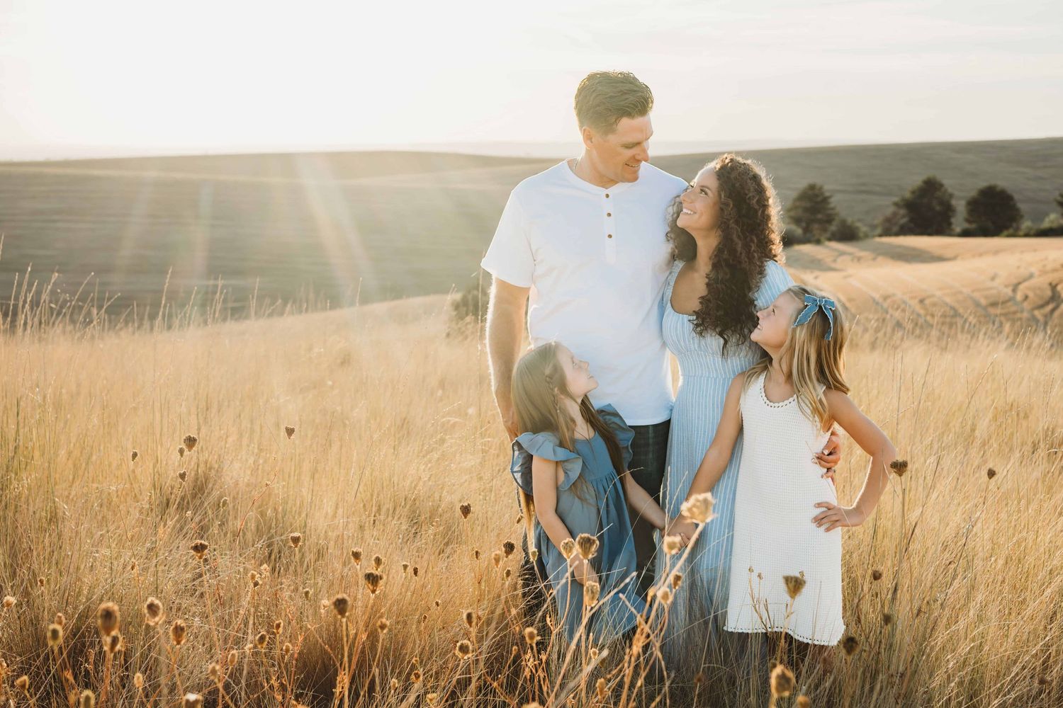 A family portrait with beautiful golden hour lighting at Bennington Lake in Walla Walla.