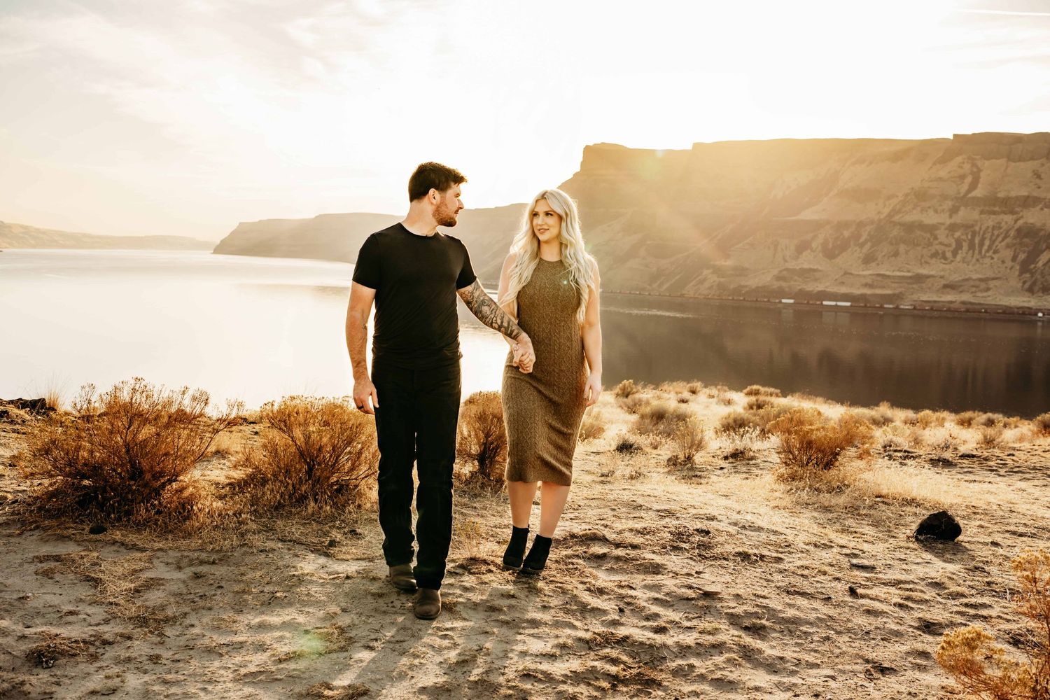 A portrait of a couple walking and talking to each other at Twin Sisters near Walla Walla.