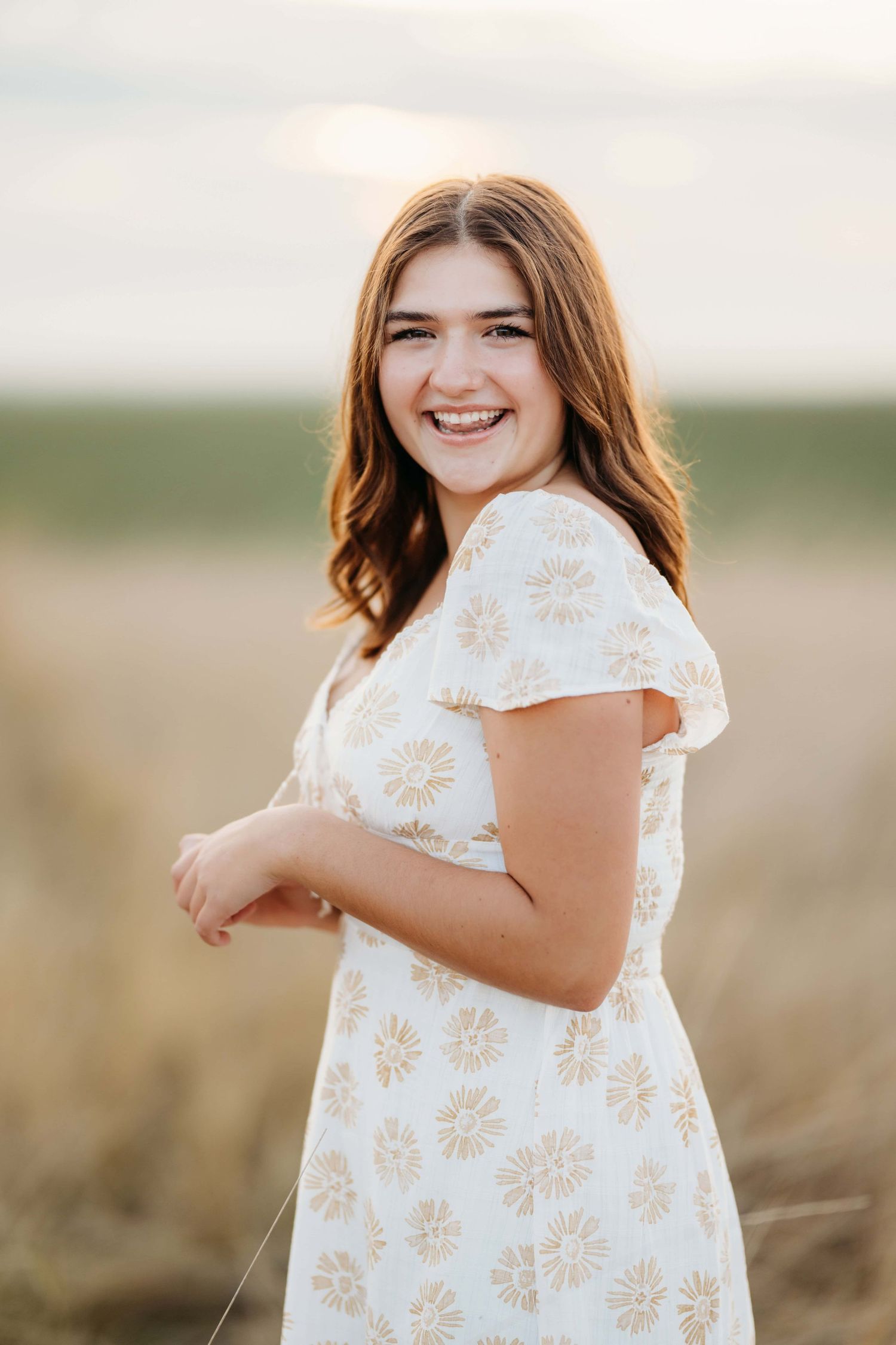 A girl laughing at the camera during her senior session in Wenatchee.