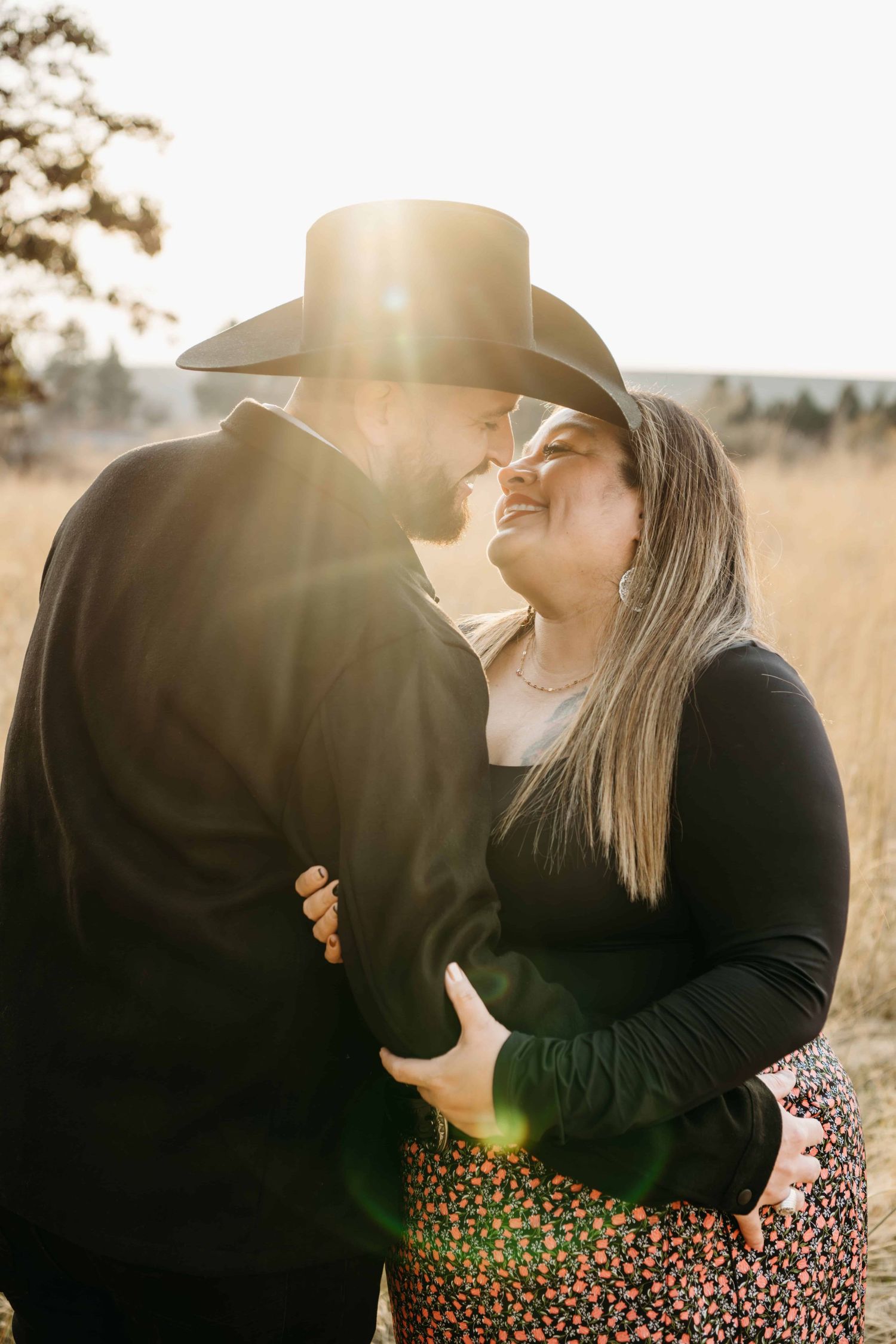 Romantic portrait of a couple sharing a quiet moment in warm sunset light during a Walla Walla couples session.