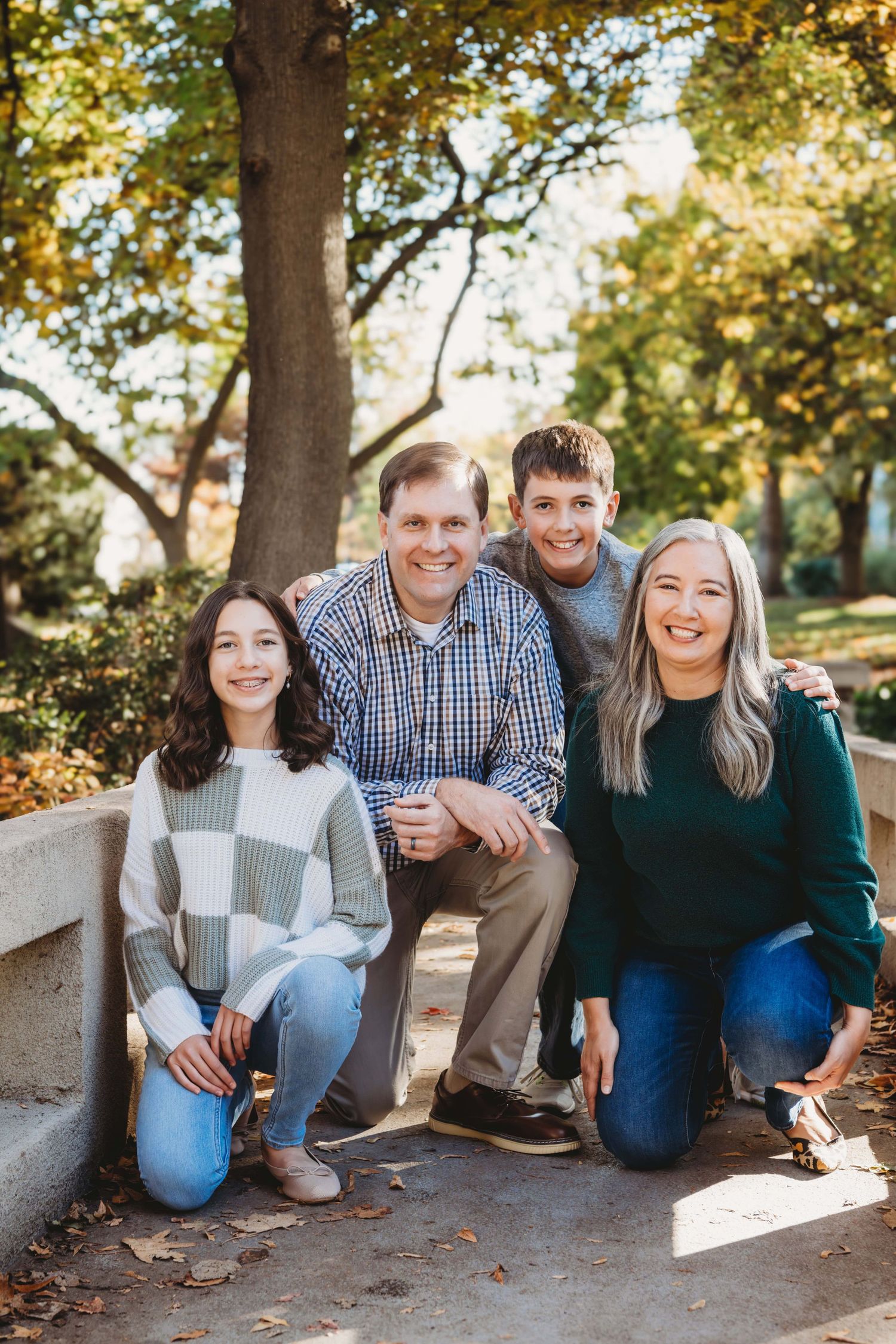 A family of four on a bridge at Whitman College in Walla Walla.