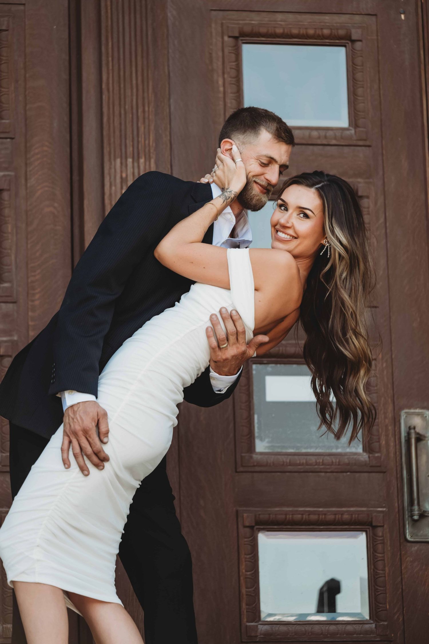 A bride and groom standing outside the courthouse, taken by a Walla Walla elopement photographer.