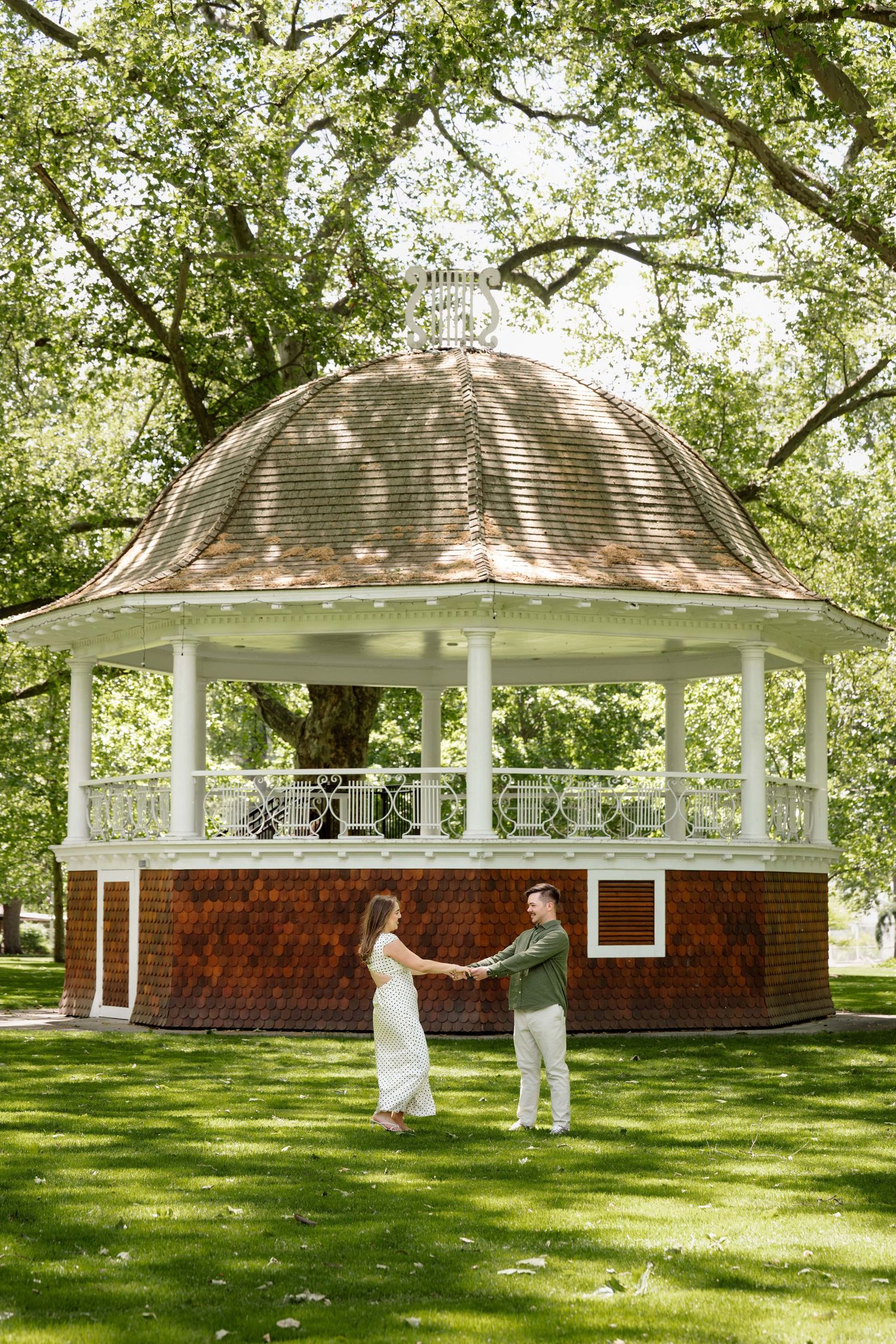 A couple dancing with a gazebo behind them at Pioneer Park in Walla Walla.