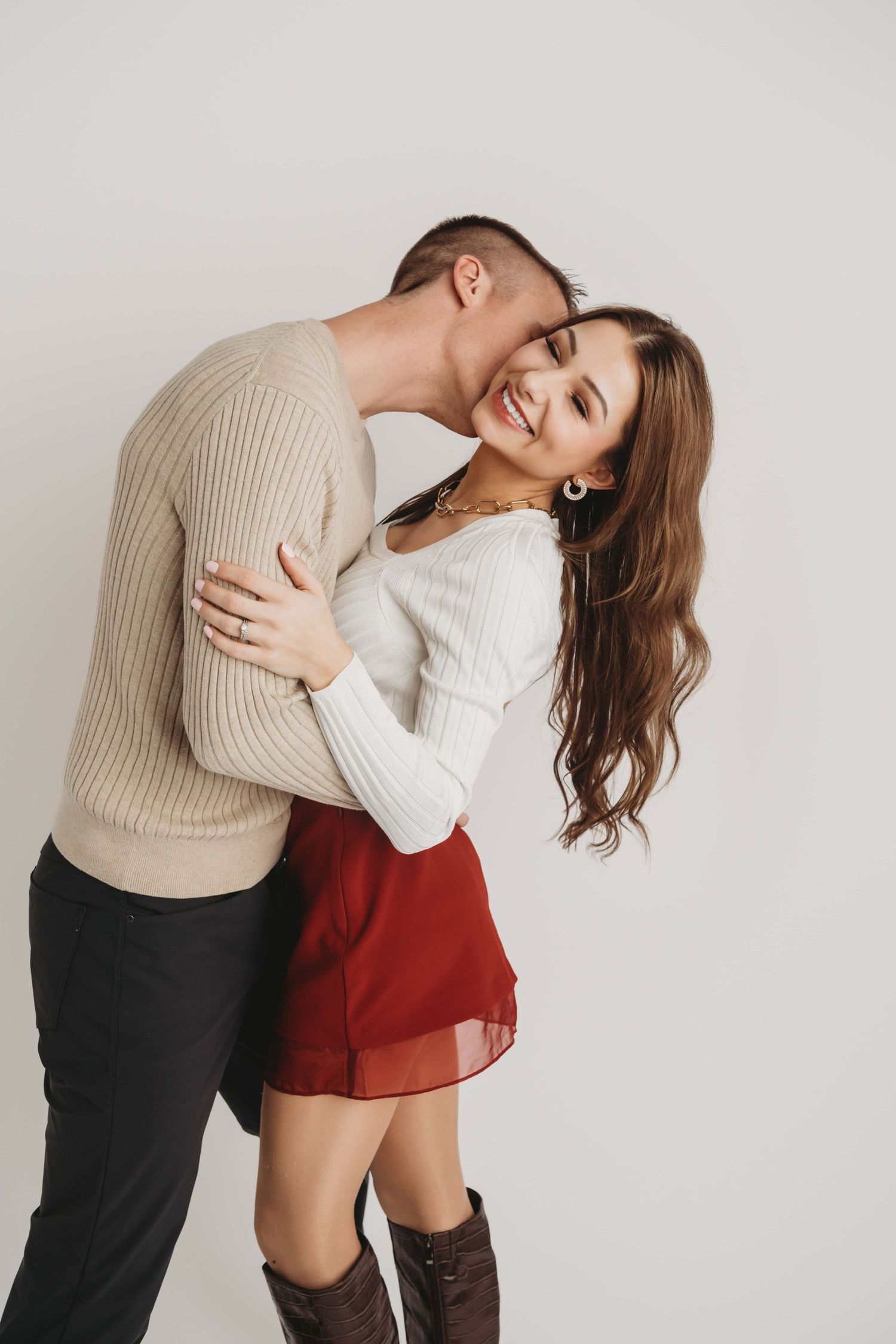 Romantic studio portrait of a couple laughing and holding each other during a Walla Walla couples session
