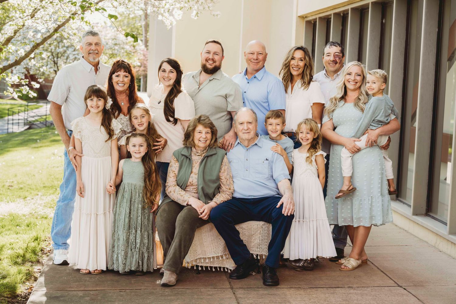A portrait of a large family in the spring time with pastel colors.