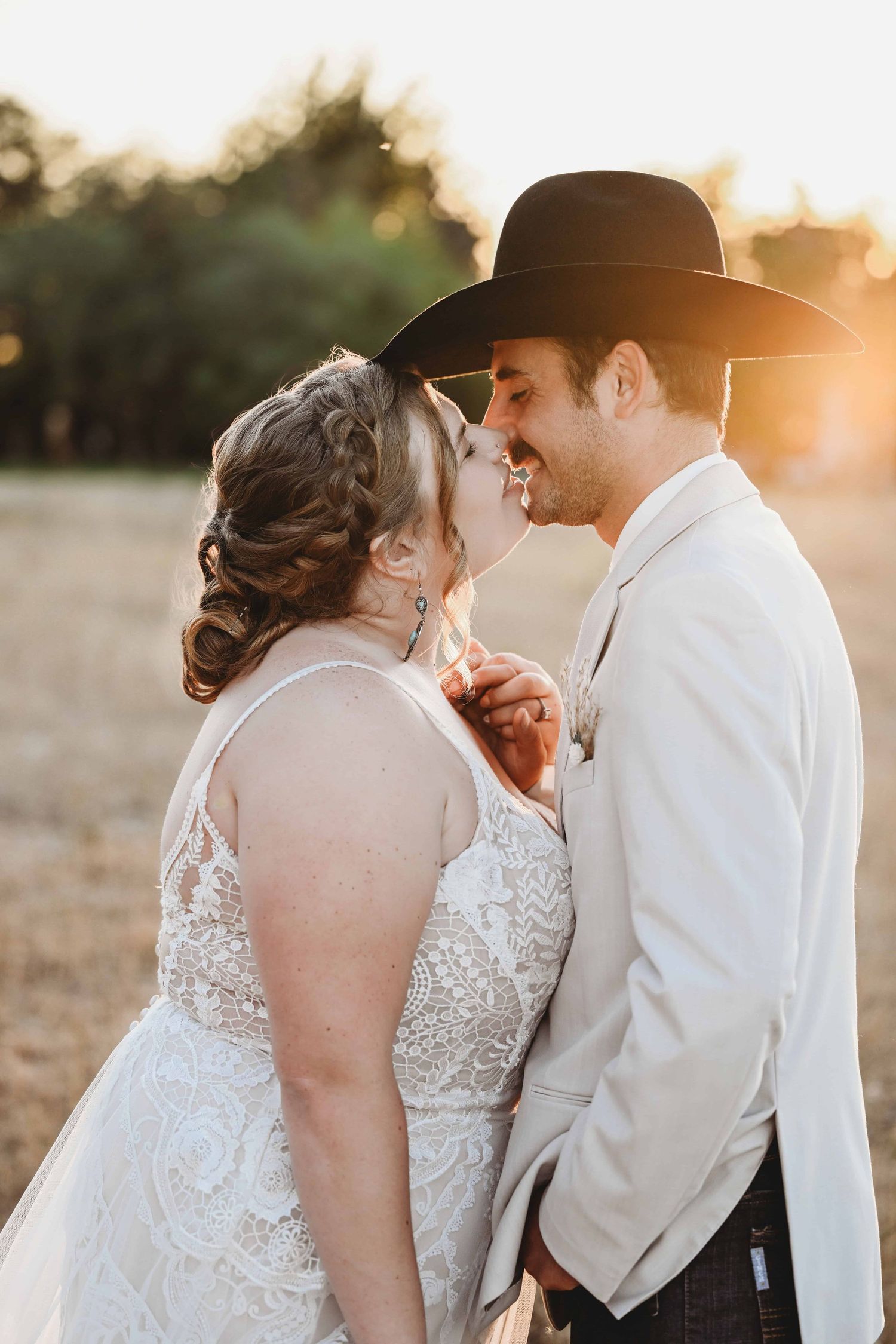A bride and groom sharing a kiss at golden hour in Walla Walla.