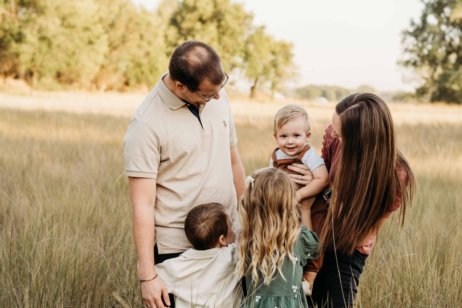 A candid moment of a family of five playfully laughing together in Walla Walla.