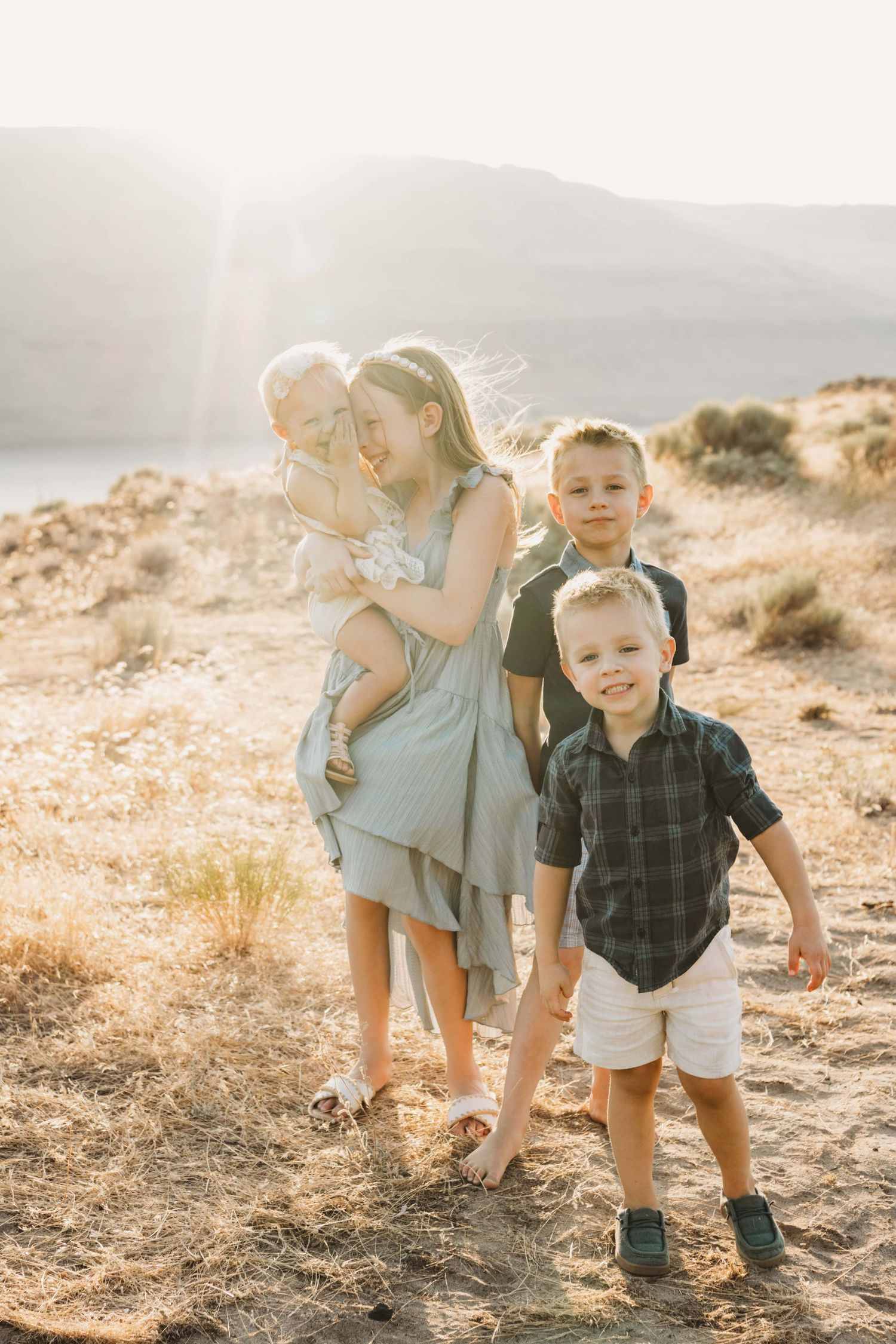 A portrait of four children playing together at Twin Sisters near Walla Walla.