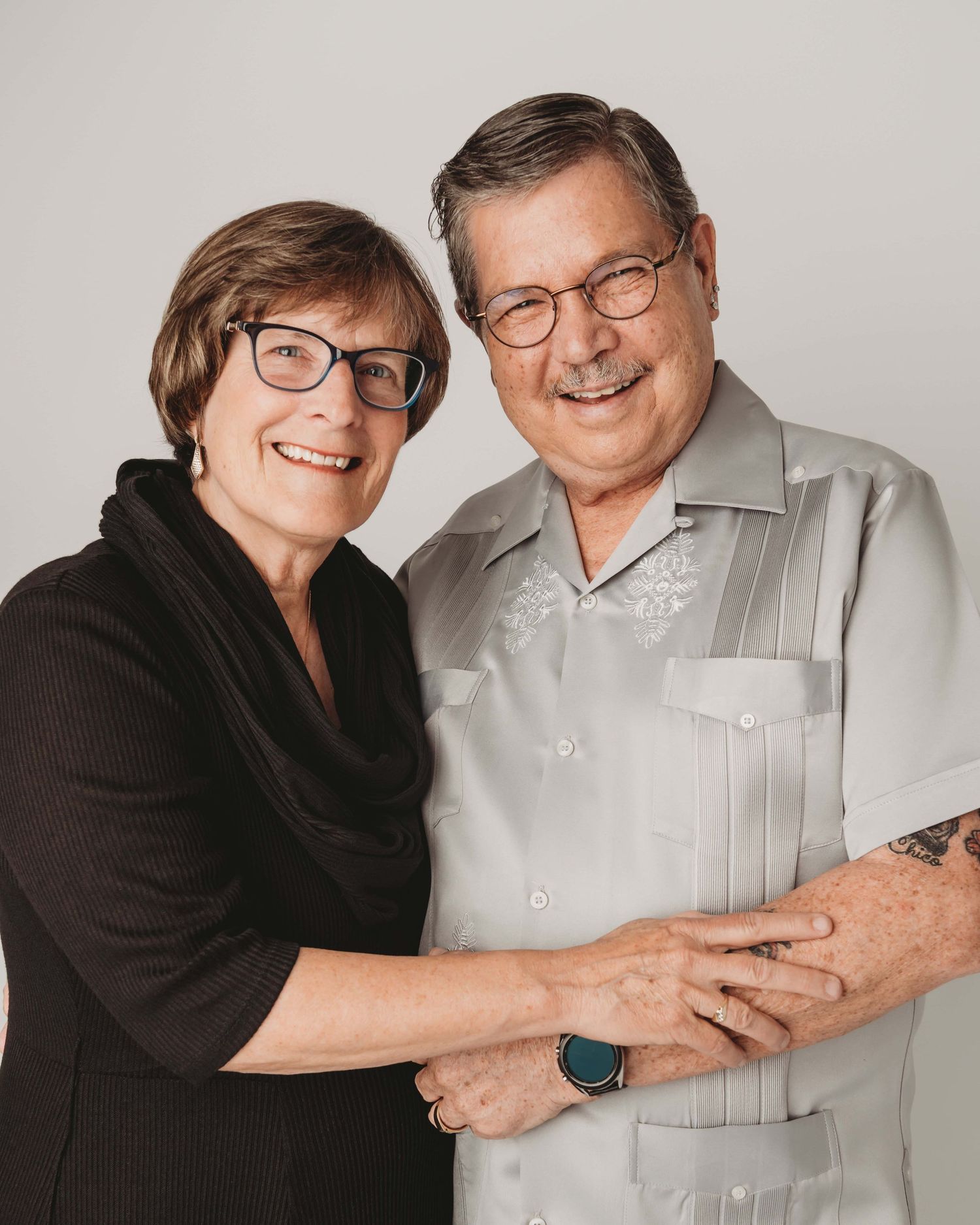 Relaxed studio couples portrait of an older couple embracing, taken at a Walla Walla photography studio with soft natural lighting.