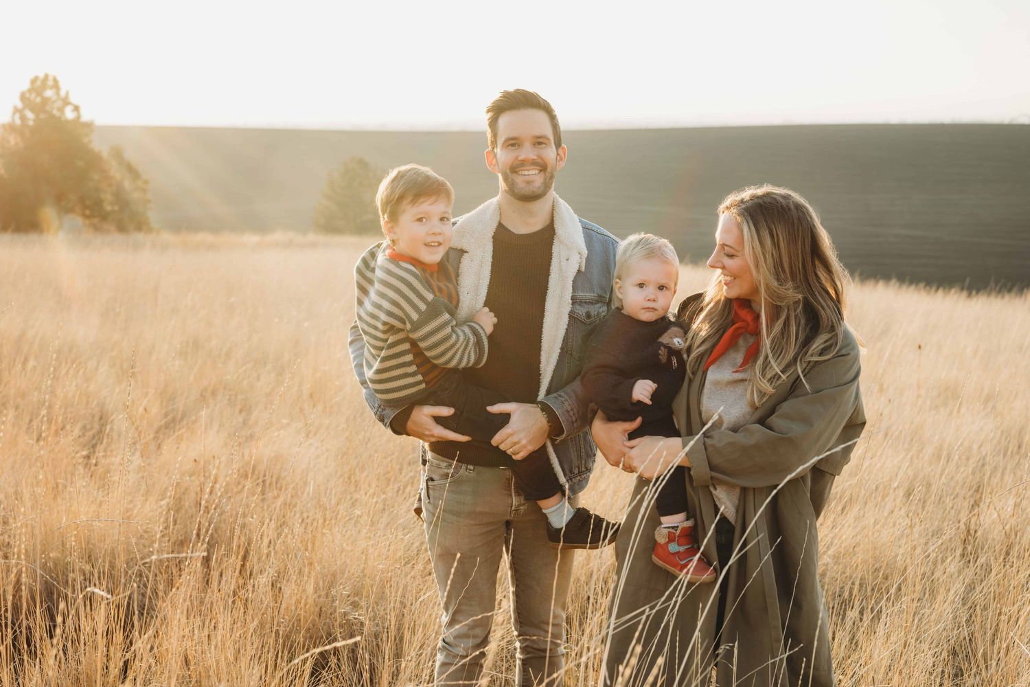 A Walla Walla photographer captures a sunlight filled candid portrait of a family of four.
