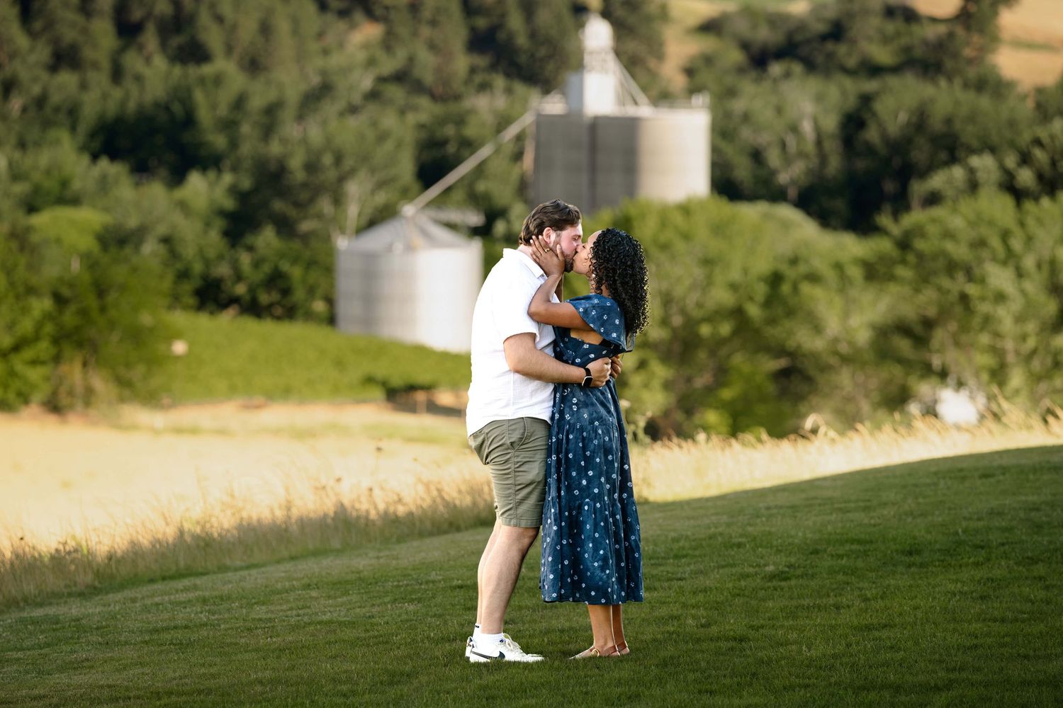 A couple kissing just after getting engaged at a winery in Walla Walla.