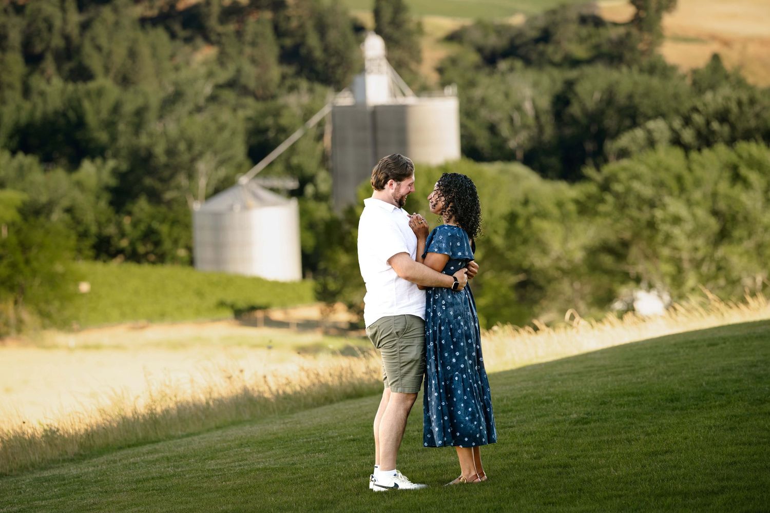 A man and woman embracing and looking at each other just after getting engaged.