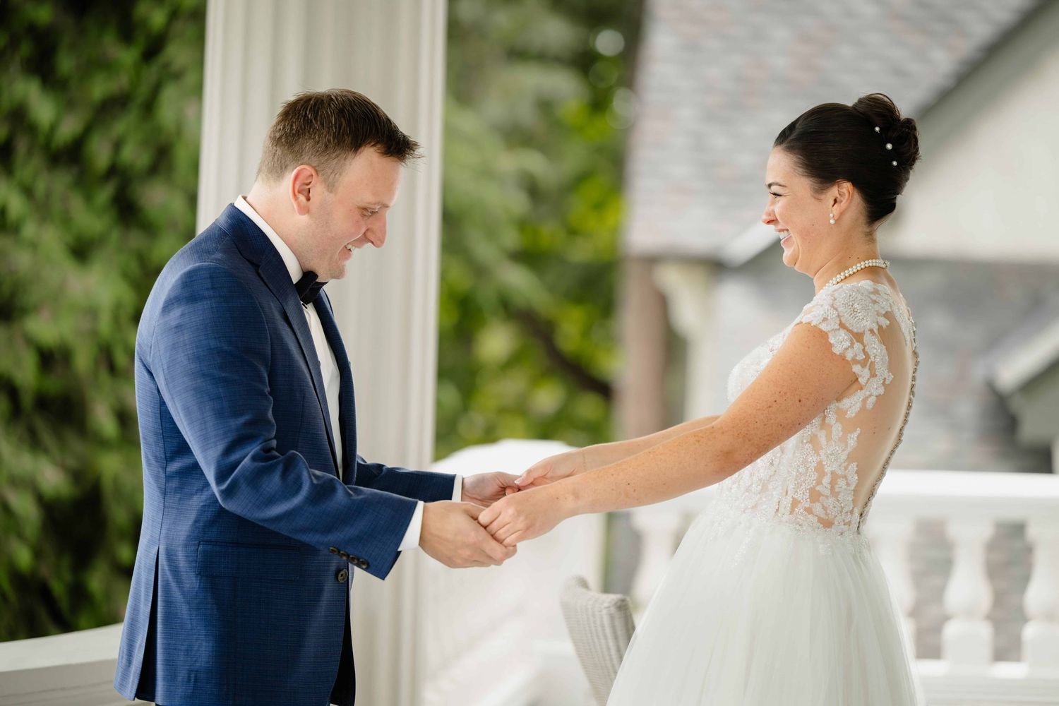 A couple laughing together during their first look