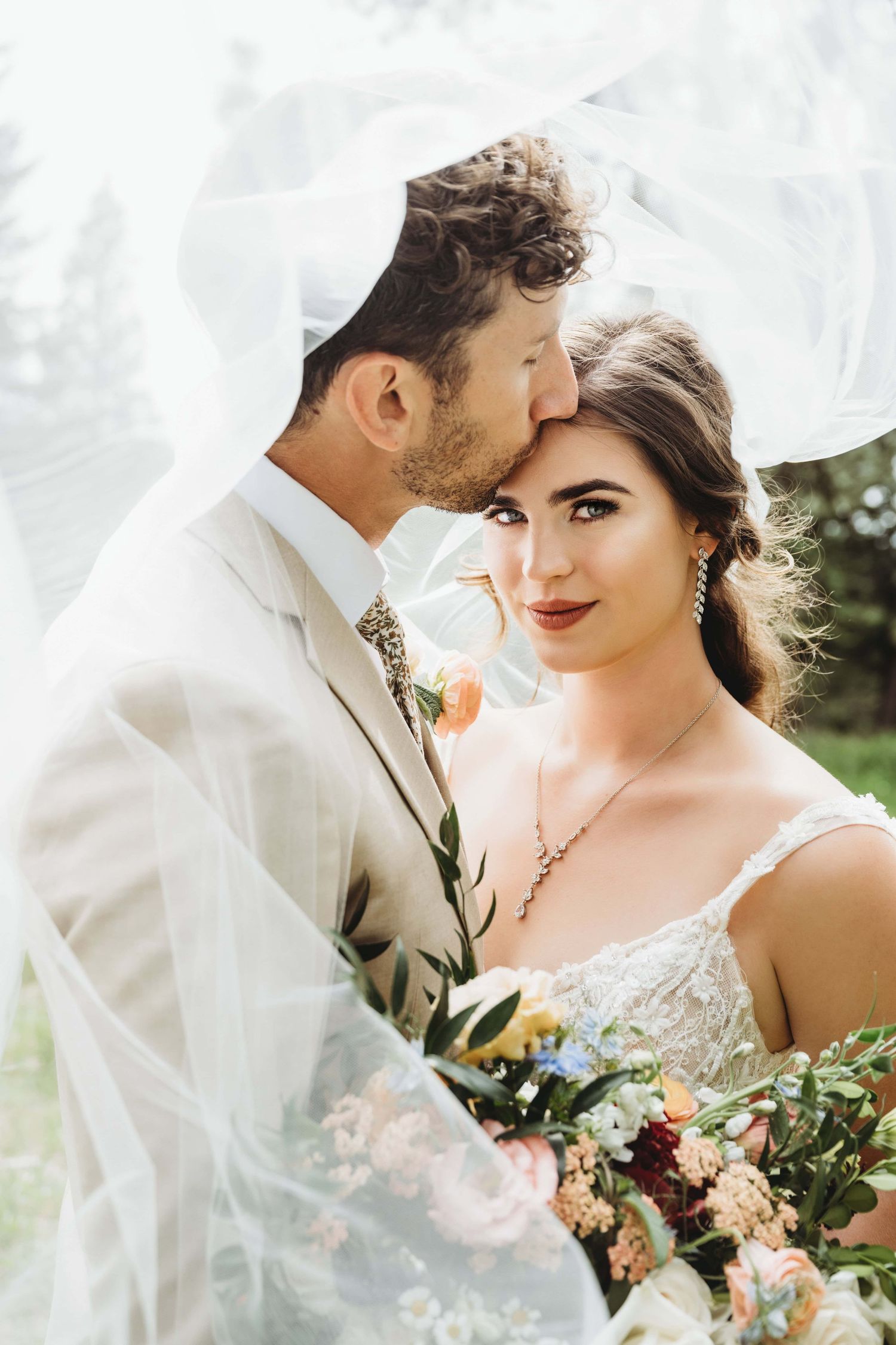 Bride and groom embracing during sunset wedding portraits by Brittani Smith Photography, serving the Tri-Cities and Eastern Washington.