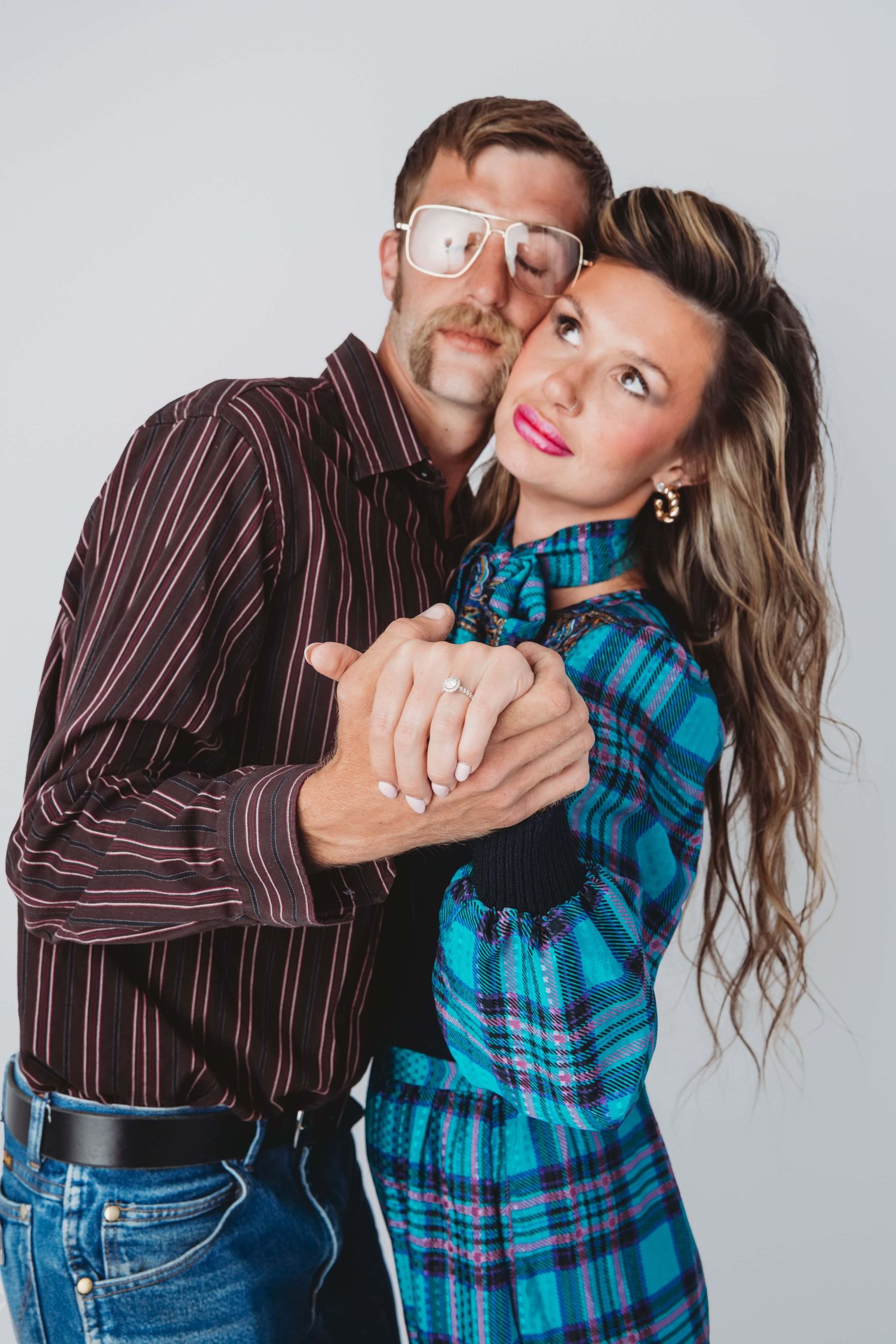 Couple smiling and leaning foreheads together in a relaxed studio couples photography session in Walla Walla