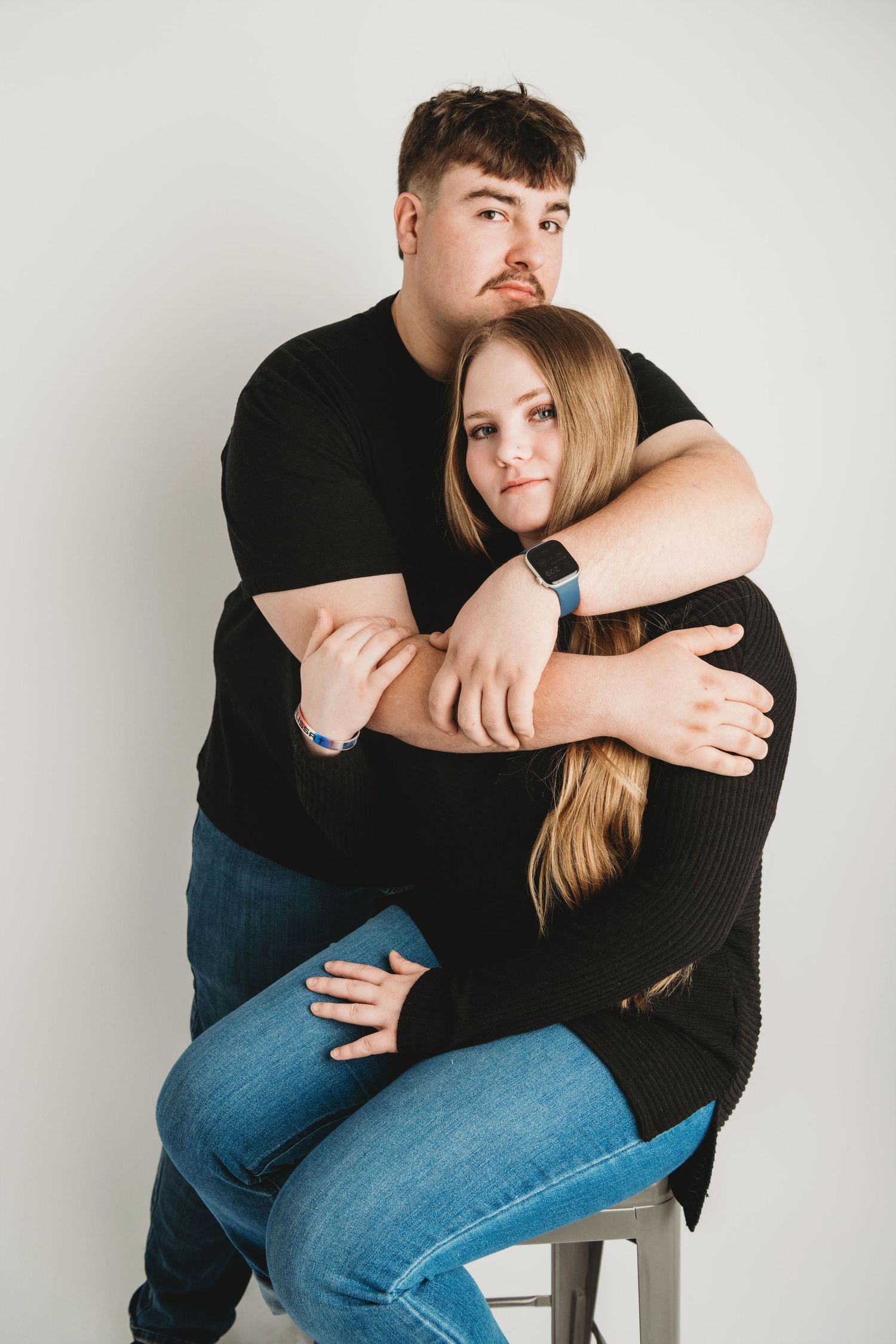 Studio portrait of a young couple hugging and smiling during a Walla Walla engagement photography session
