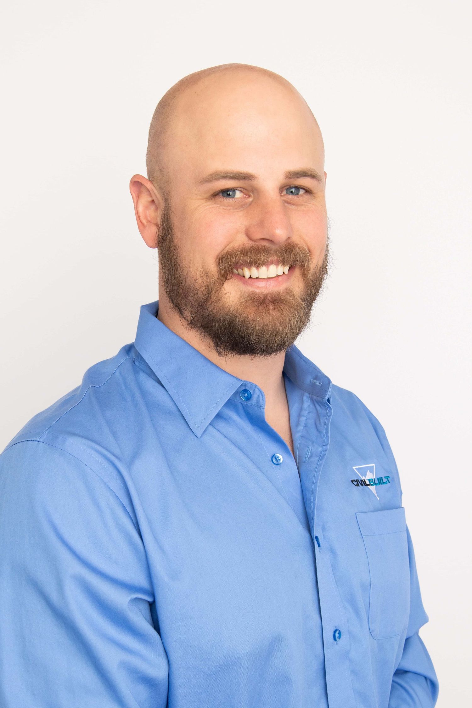 A local business man poses for a headshot portrait at a Walla Walla photography studio.