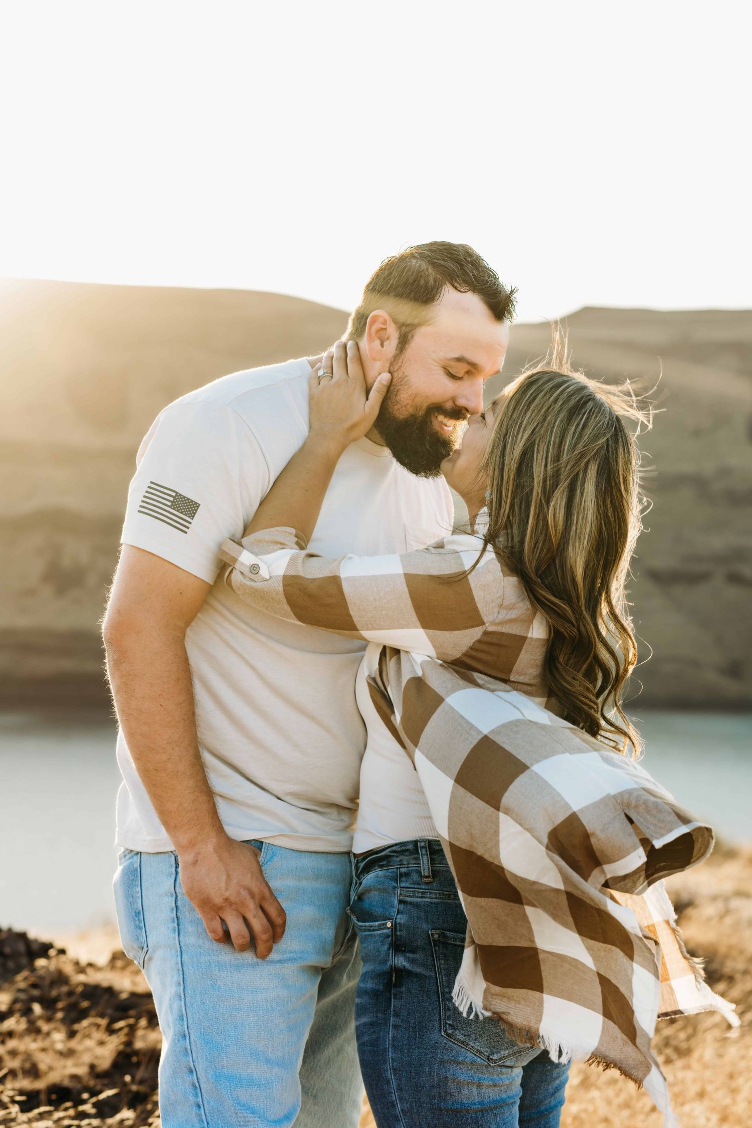 An intimate moment captured of a couple on a windy day at Twin Sisters Rock near Walla Walla.