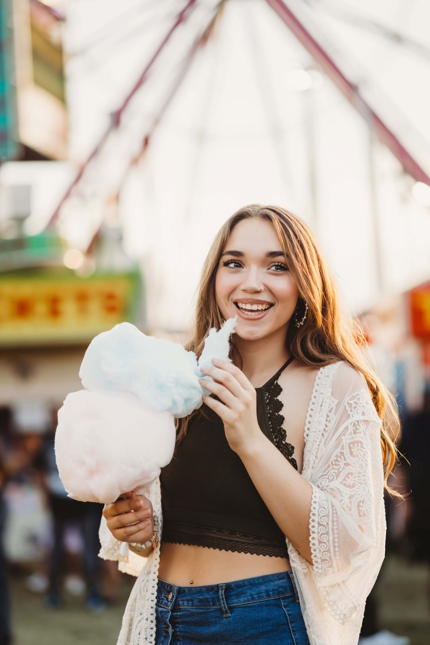 A senior eating cotton candy at the county fair in Walla Walla, Washington.