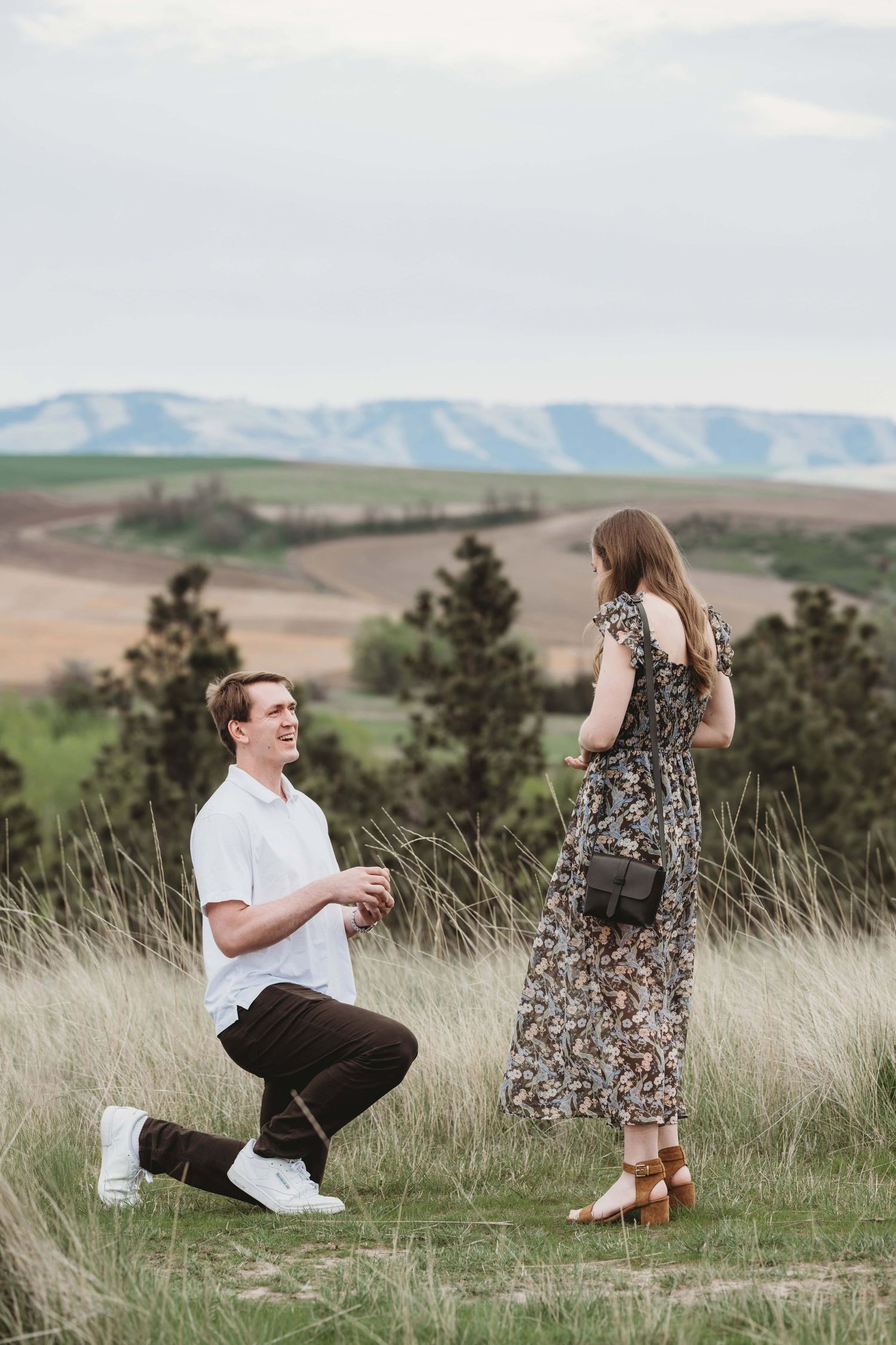A man proposing to his partner in front of Bennington Lake in Walla Walla.