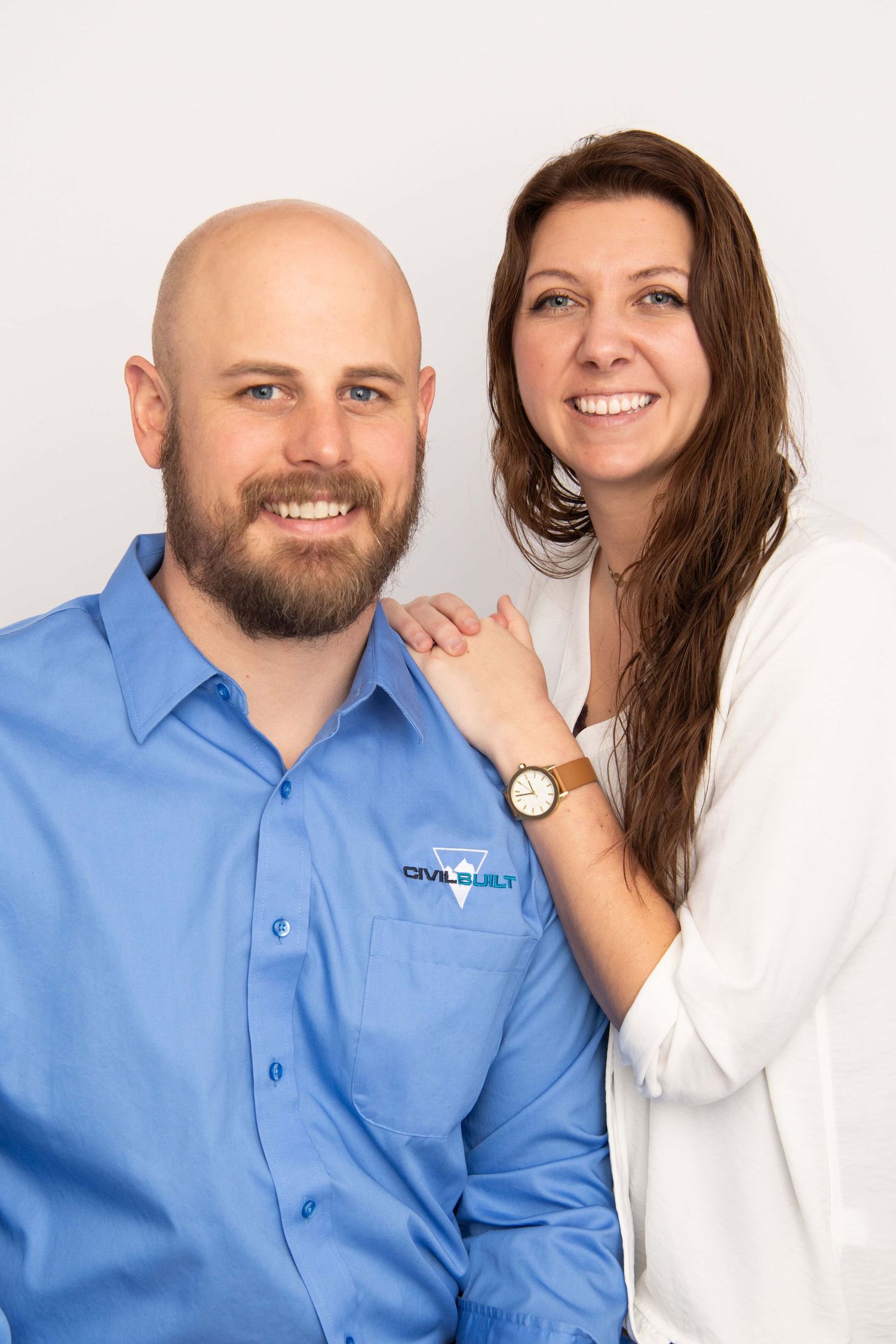 A professional business headshot of a man and woman taken by Brittani Smith Photography in Walla Walla.