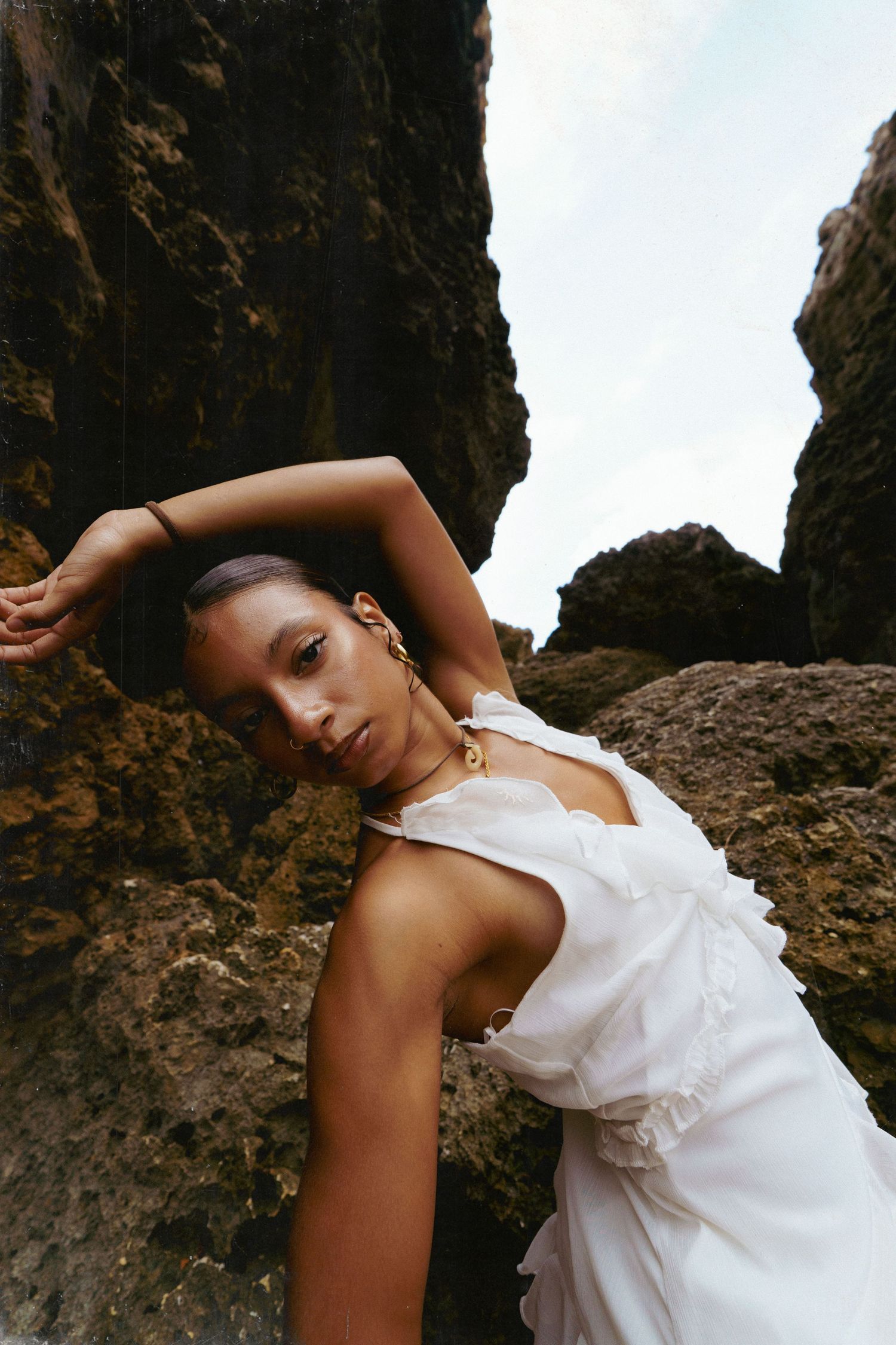 A model posing in a beach in Isabella Puerto Rico. Kodak film 35mm editorial photography.