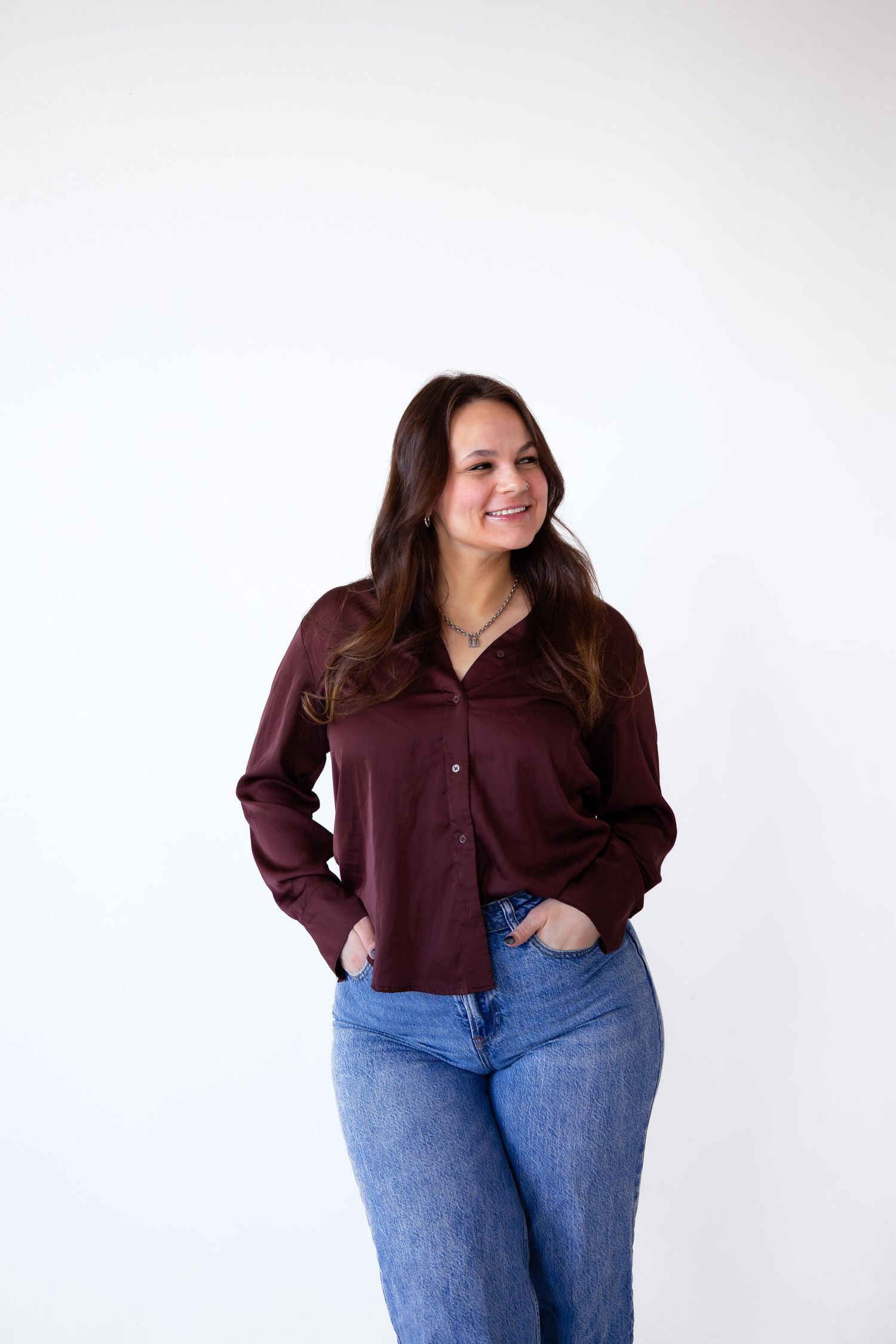 Fashion series showcasing burgundy button-down shirt and blue jeans in casual poses.
