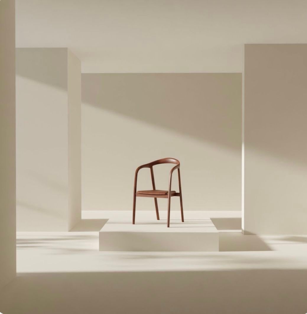 Minimalist interior space with a single wooden chair casting long shadows in natural light. Kangaroo Island Haus Home KI Cleaning airbnb