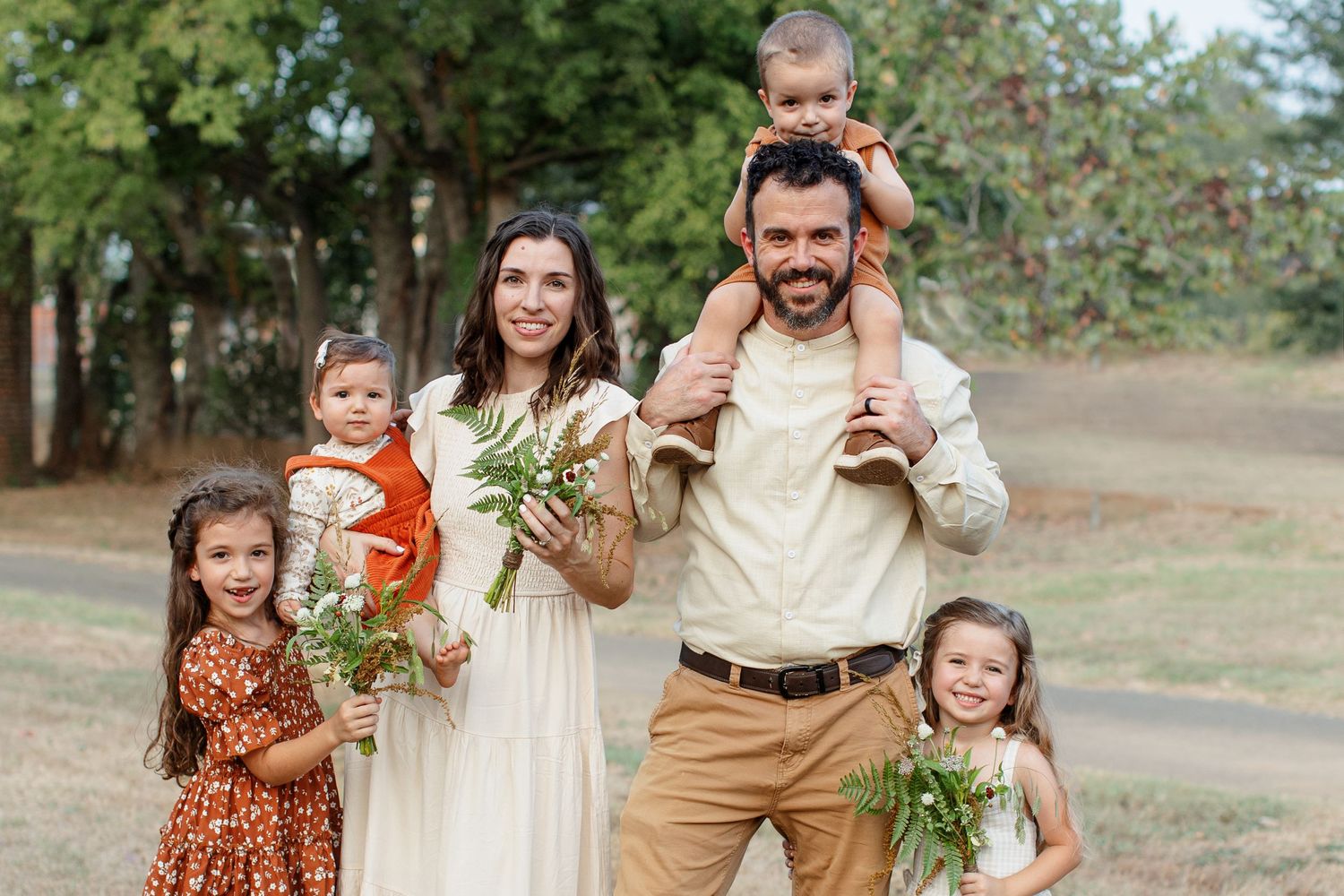 Natural light portrait of a young family with four children, by Emily Joy Photography, now a wedding photographer in Memphis, TN.