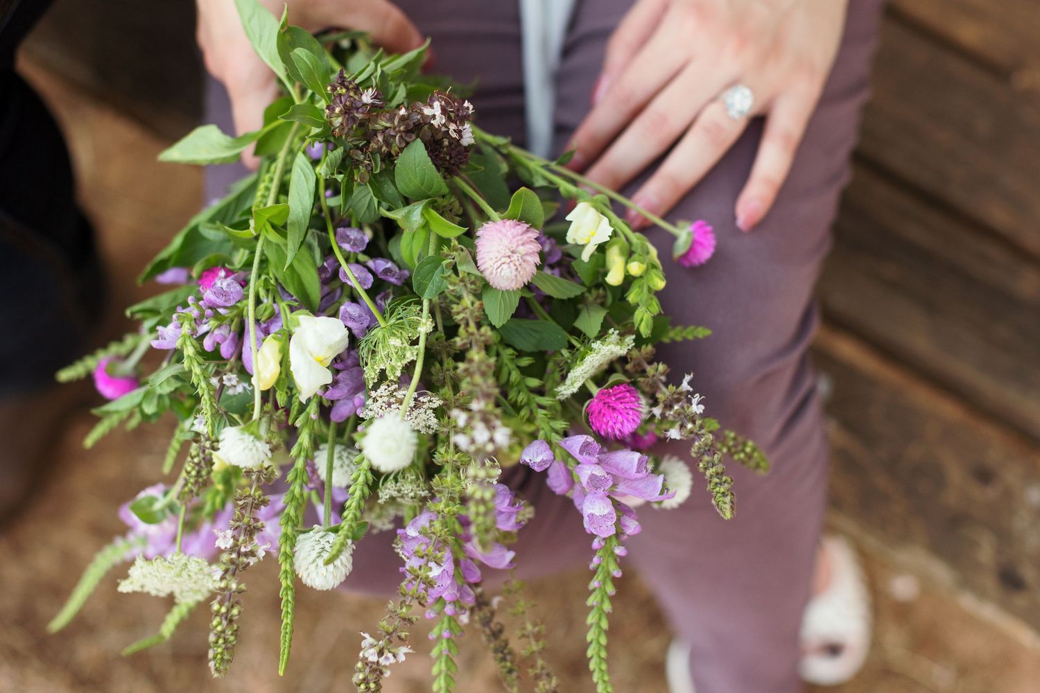 A picture of a whimsy purple and white boquet, by Emily Joy Photography, now a wedding photographer in Memphis, TN.