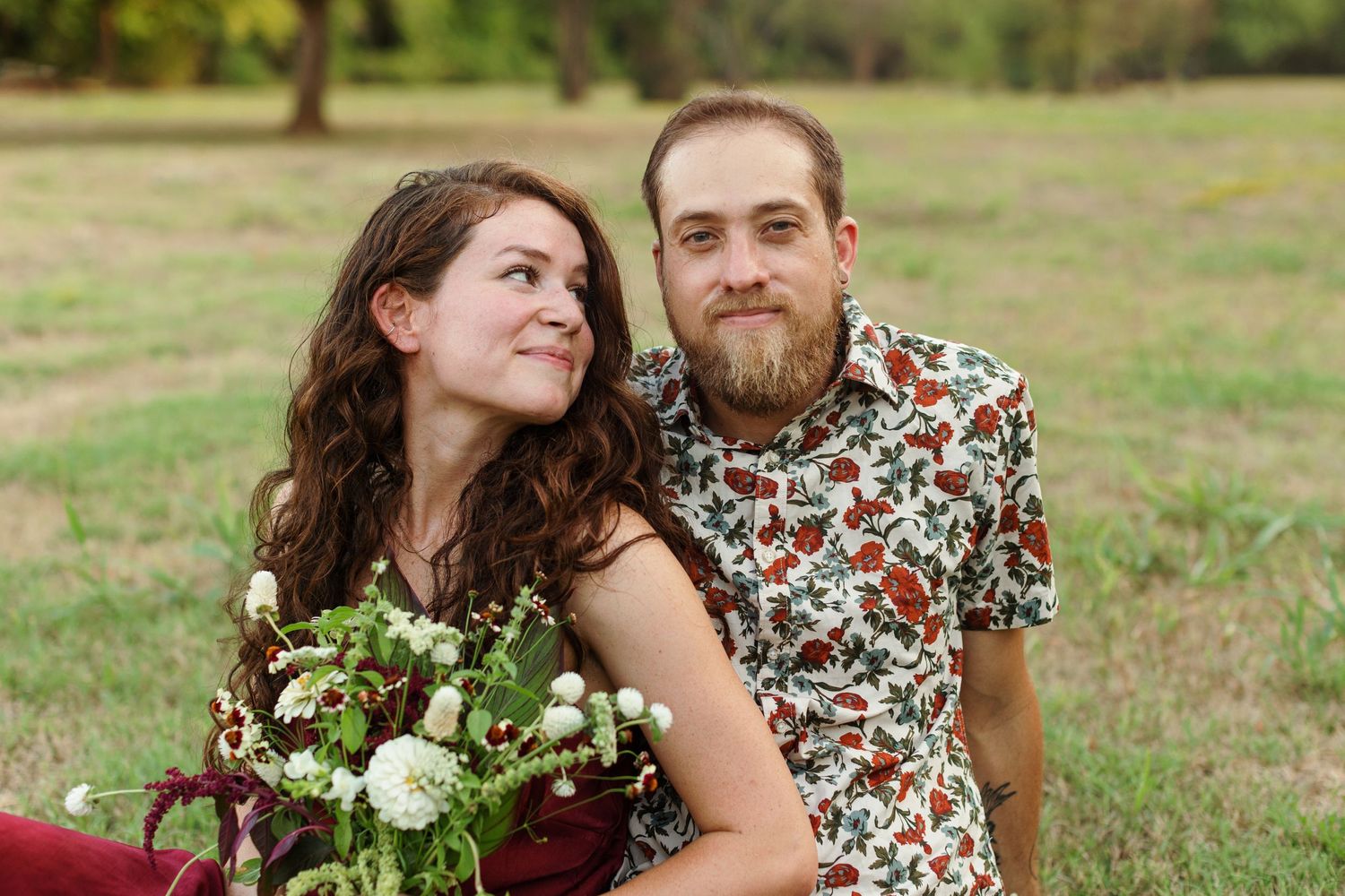 Young engaged woman admires her fiancé for a portrait by Nacogdoches photographer Emily Joy Photography