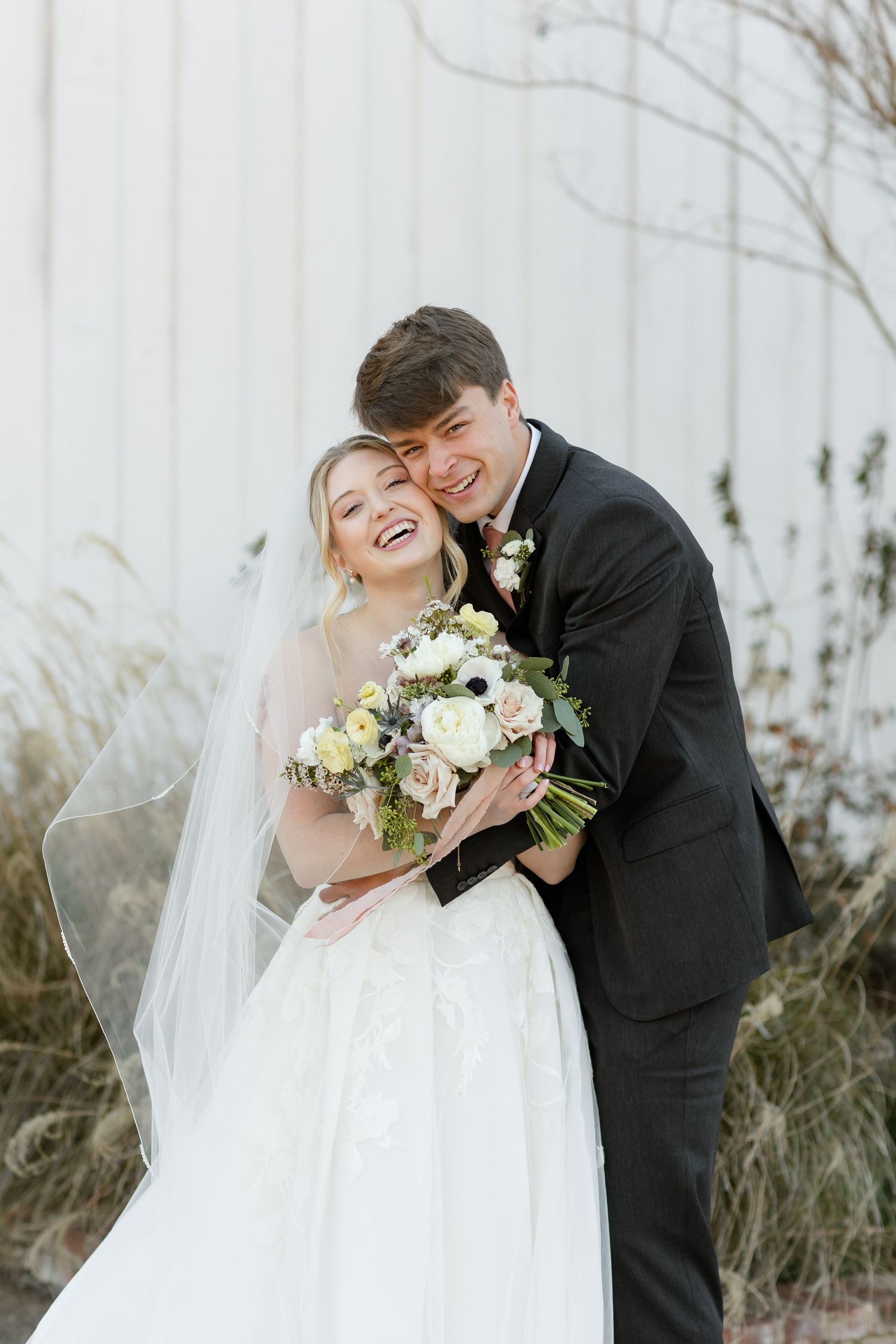 A happy bride and groom smile for a wedding portrait at the Robinshaw Wedding venue in Memphis, TN.